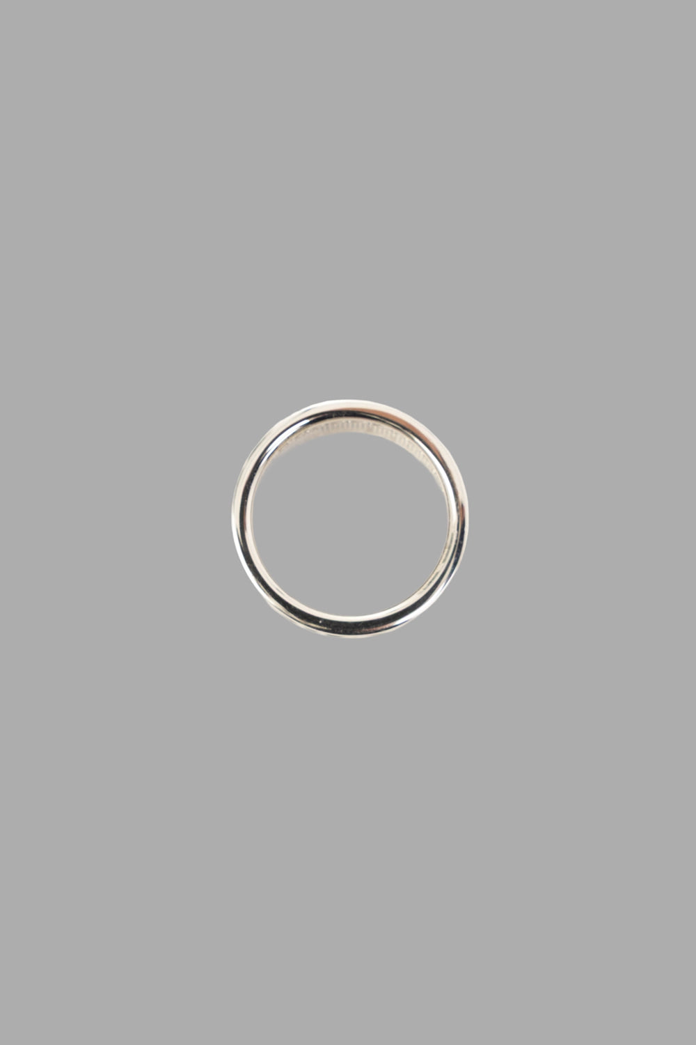 Vivienne Westwood ring in platinum, front view, chunky band and sparkling pavé setting.