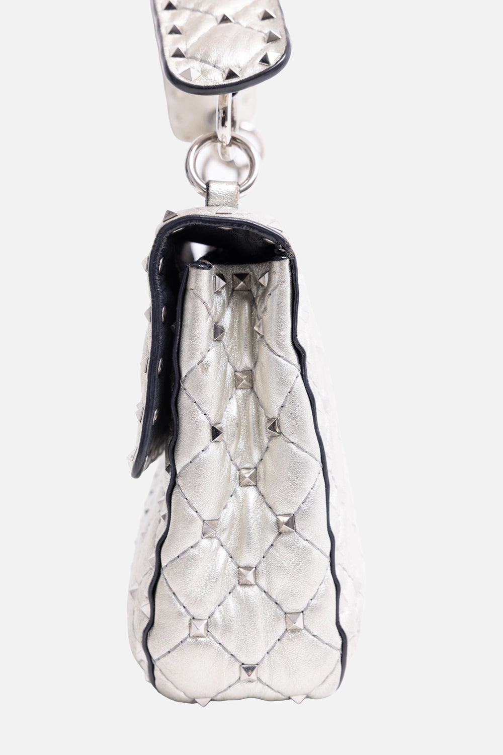 Pre-owned Valentino Garavani women's small shoulder bag in silver, side view, gusseted profile with studded edges