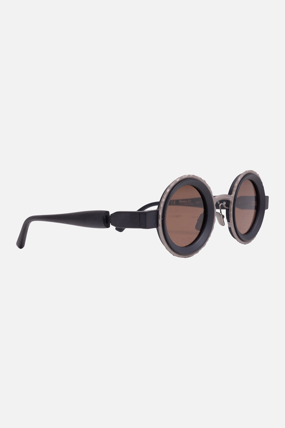 Kuboraum unisex round sunglasses in natural titanium and black matt, 3/4 view, black temples and nose pads