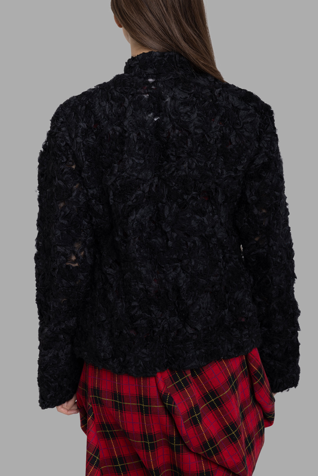 Comme des Garçons women's black ruffled mesh jacket, back view highlighting semi-sheer floral texture and straight hem.