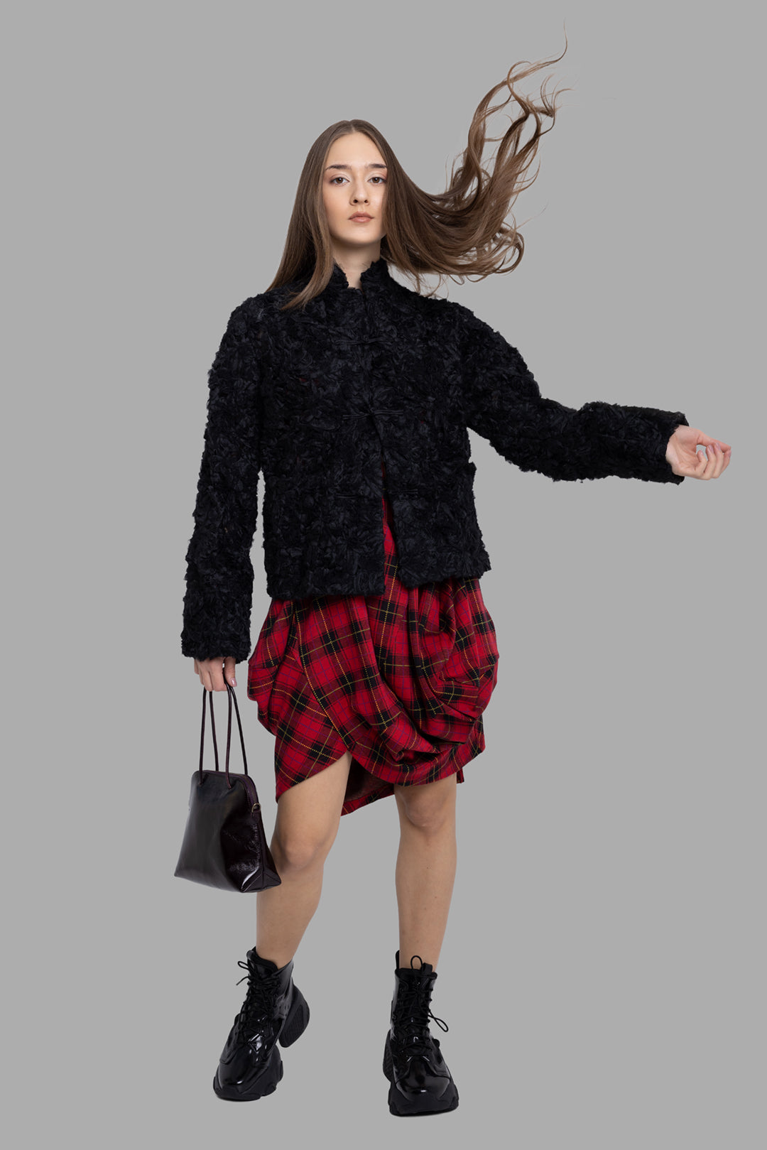 Comme des Garçons women's black ruffled mesh jacket, on-model full length, floral textured surface and stand collar.