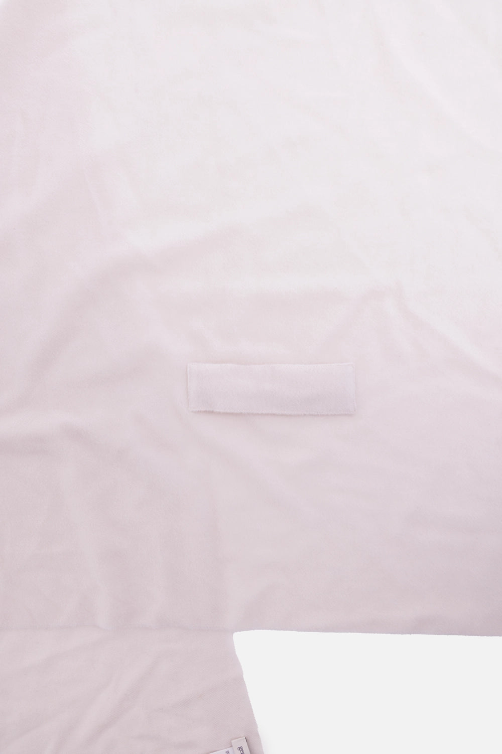 Gentry Portofino unisex scarf in Gesso, close-up with tonal rectangular loop and smooth wool surface