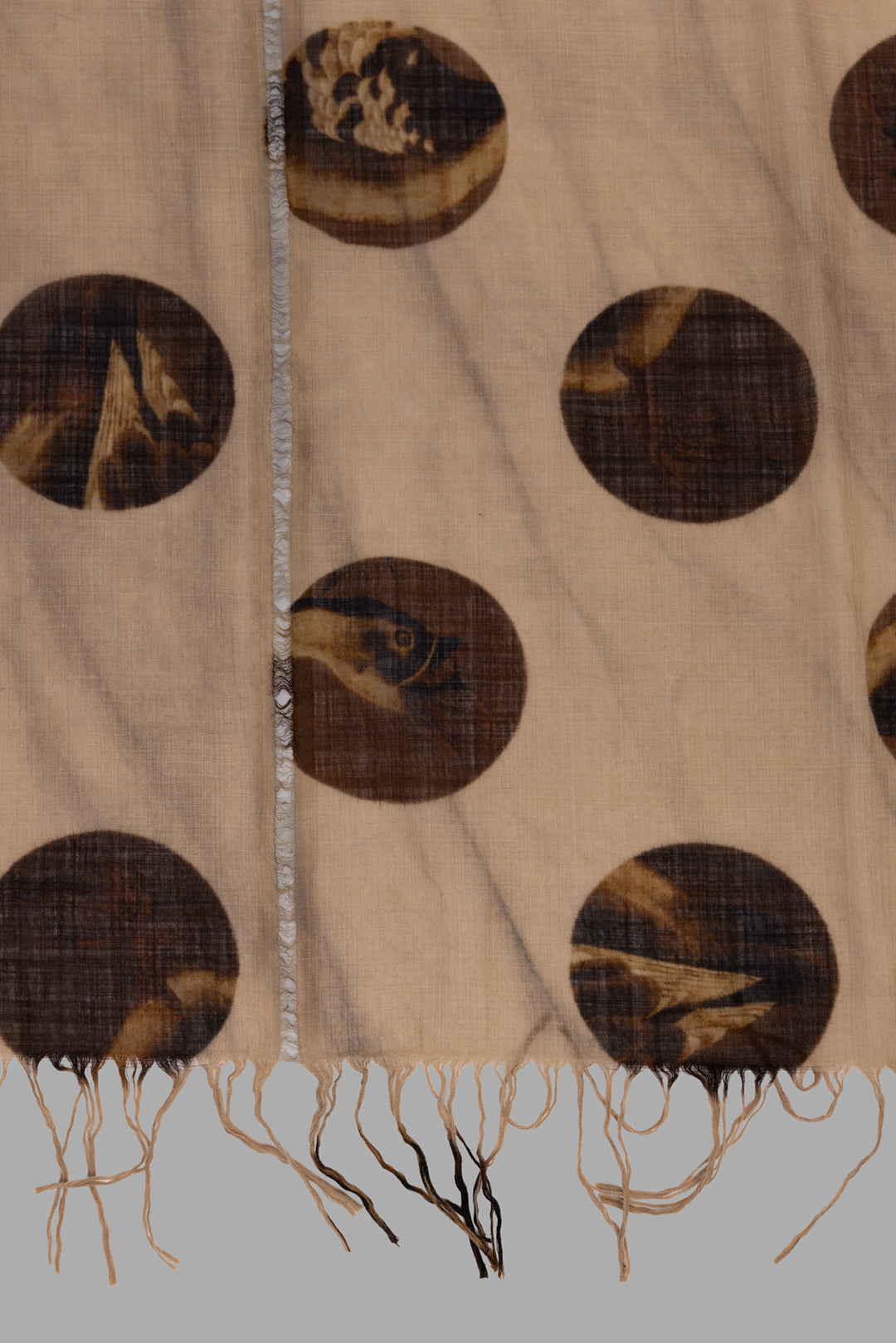 Uma Wang unisex tan brown wool scarf, close-up of gauzy weave with dark brown circle motifs and soft frayed hem.