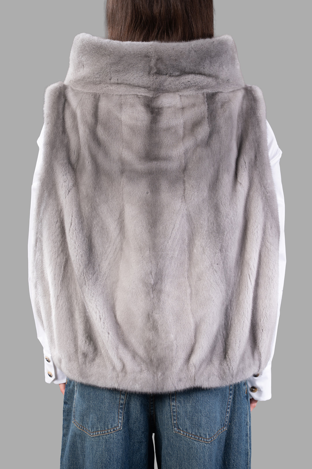Inès & Maréchal Fur Vest in grey, showcasing soft lambskin and shearling texture from the back for versatile layering.