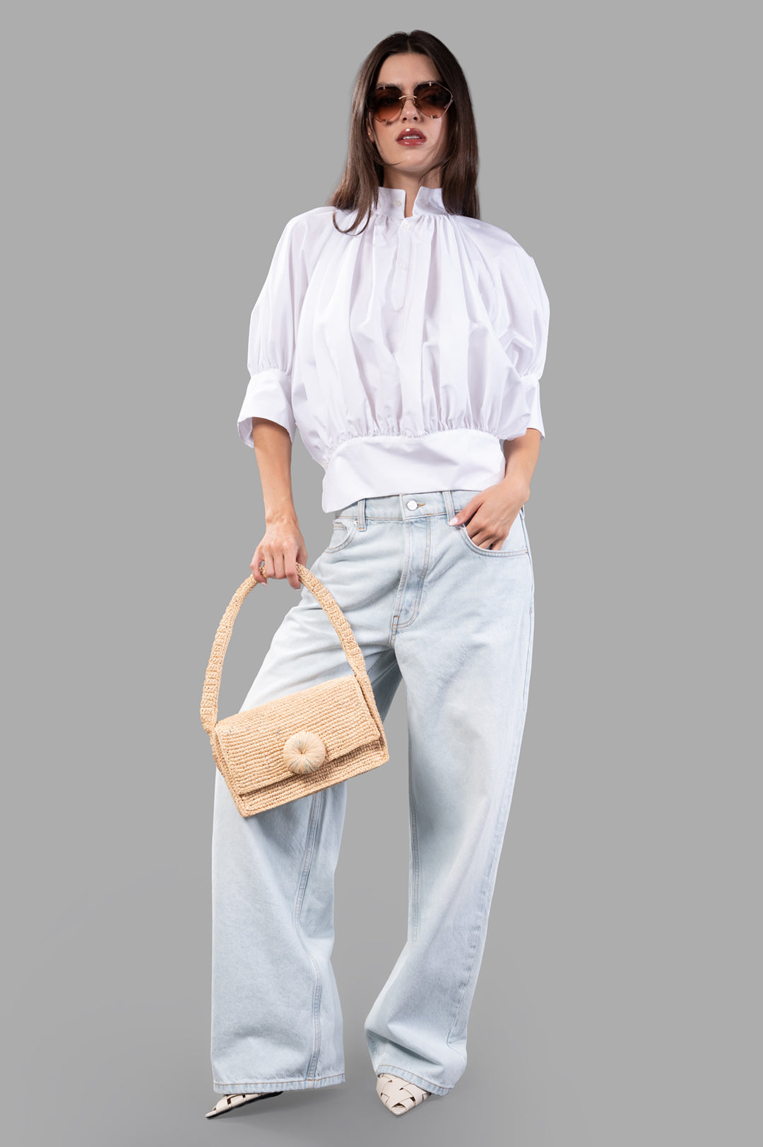 Anine Bing Manon Jeans in ultra-bleached blue, front view on model, featuring baggy silhouette and 100% cotton fabric.