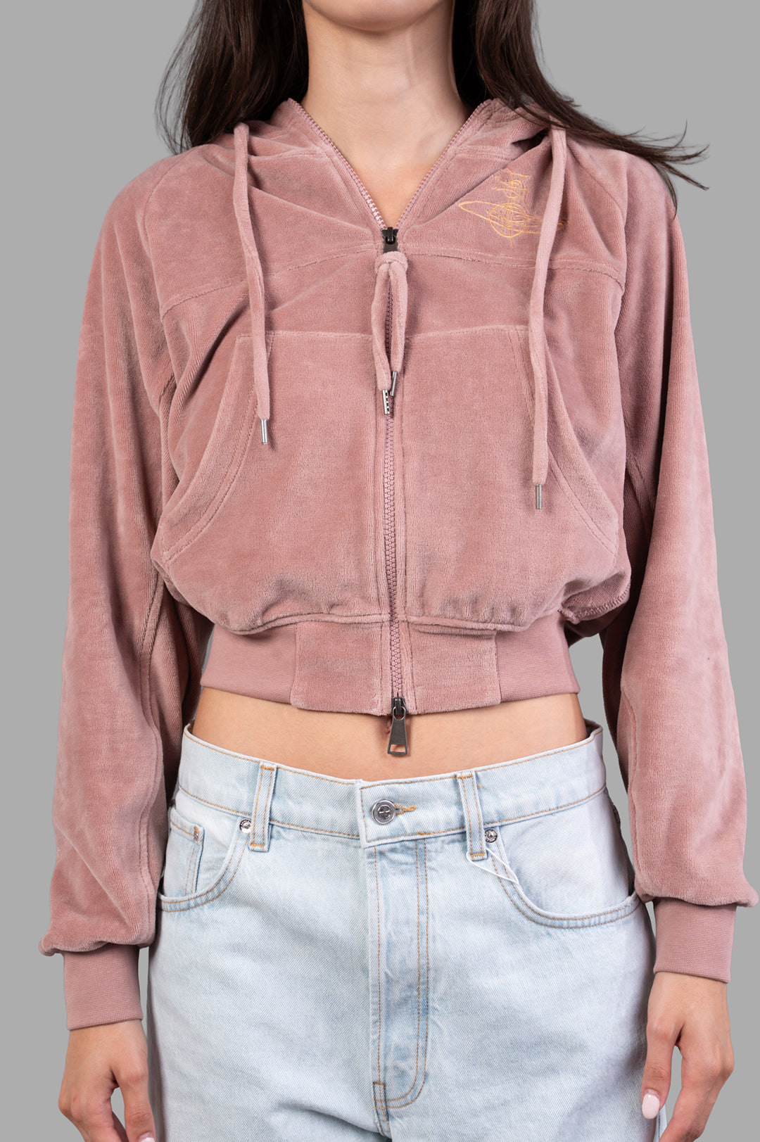 Vivienne Westwood Velvet Zip-up Hoodie styled on a model, featuring a cropped fit, front pockets, and an embroidered logo.