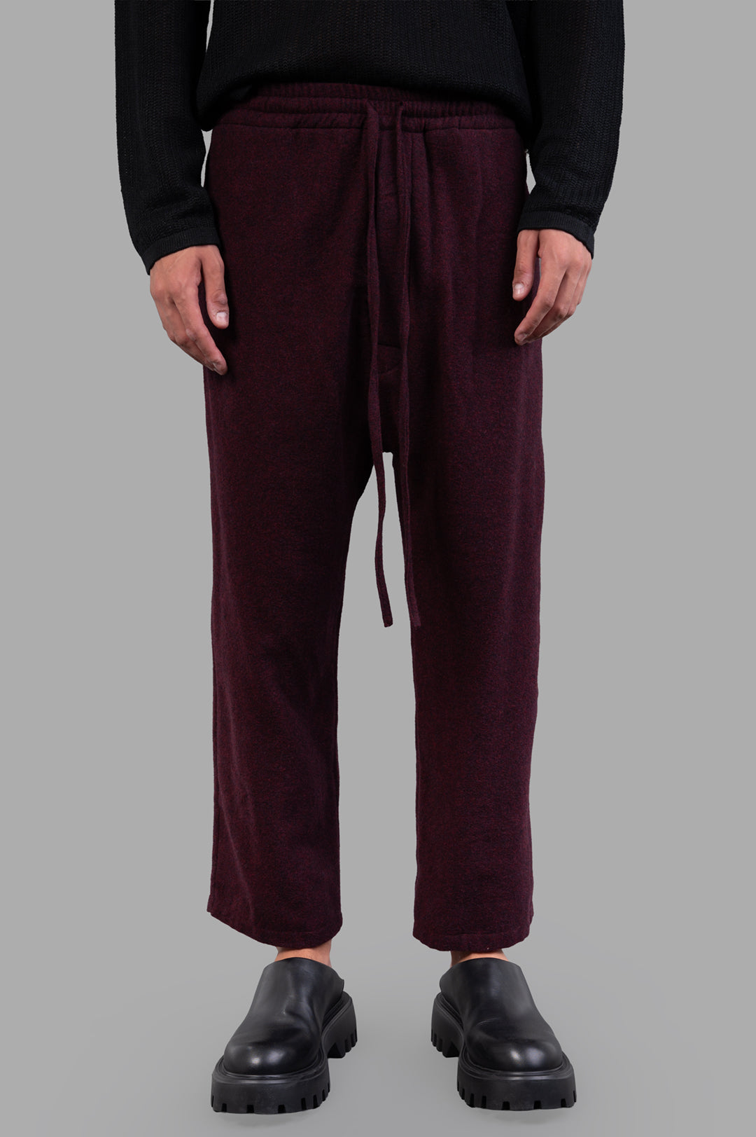 Marc Point Drawstring Trousers in burgundy, featuring an elastic waistband and adjustable drawstring, shown on model.