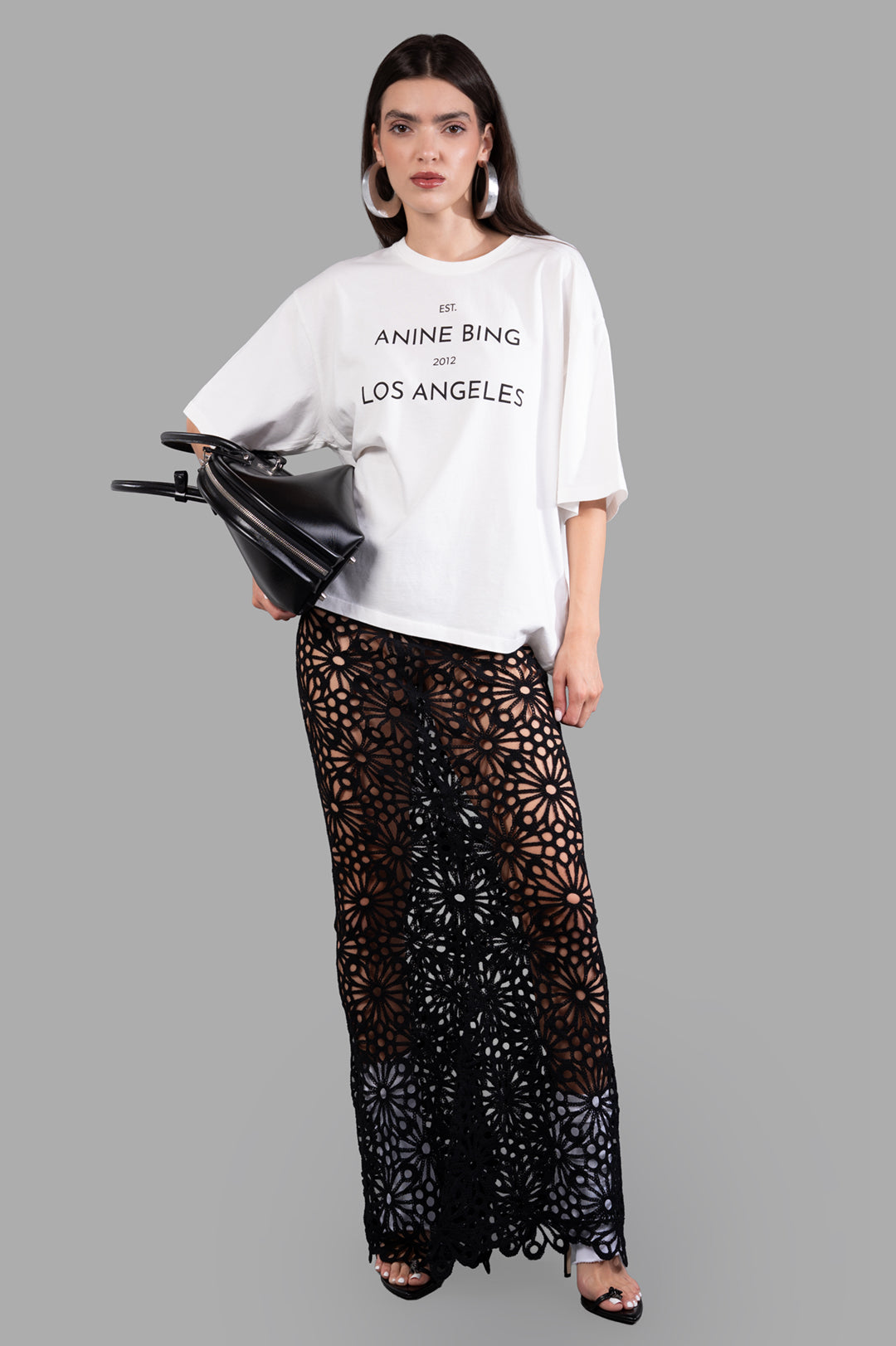 Anine Bing Logo-print T-shirt in white, shown on-model front view, features a bold logo and relaxed fit for casual style.