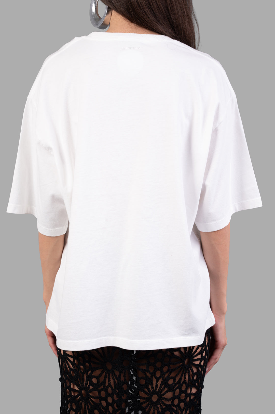 Anine Bing Logo-print T-shirt in white, showcasing a relaxed fit with dropped shoulders and short sleeves, back view.