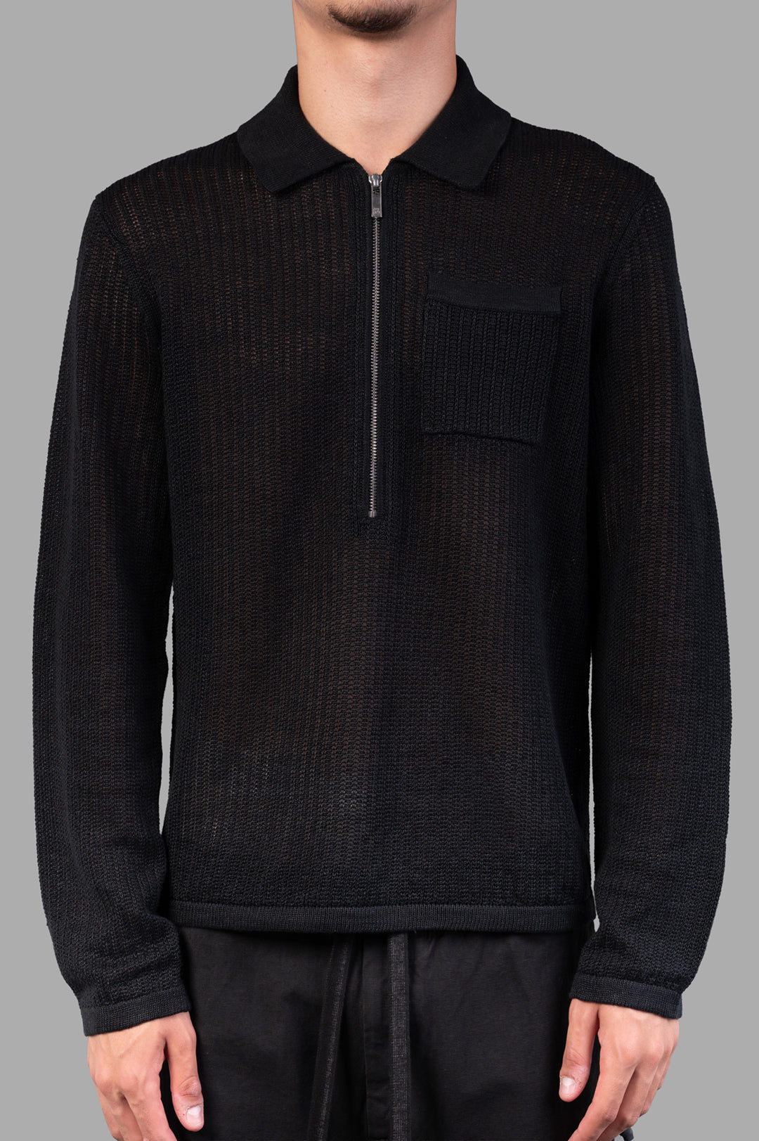 Helmut Lang Long-sleeve Zip Polo in Black, relaxed textured knit with pocket detail, model front view, made of 100% linen.