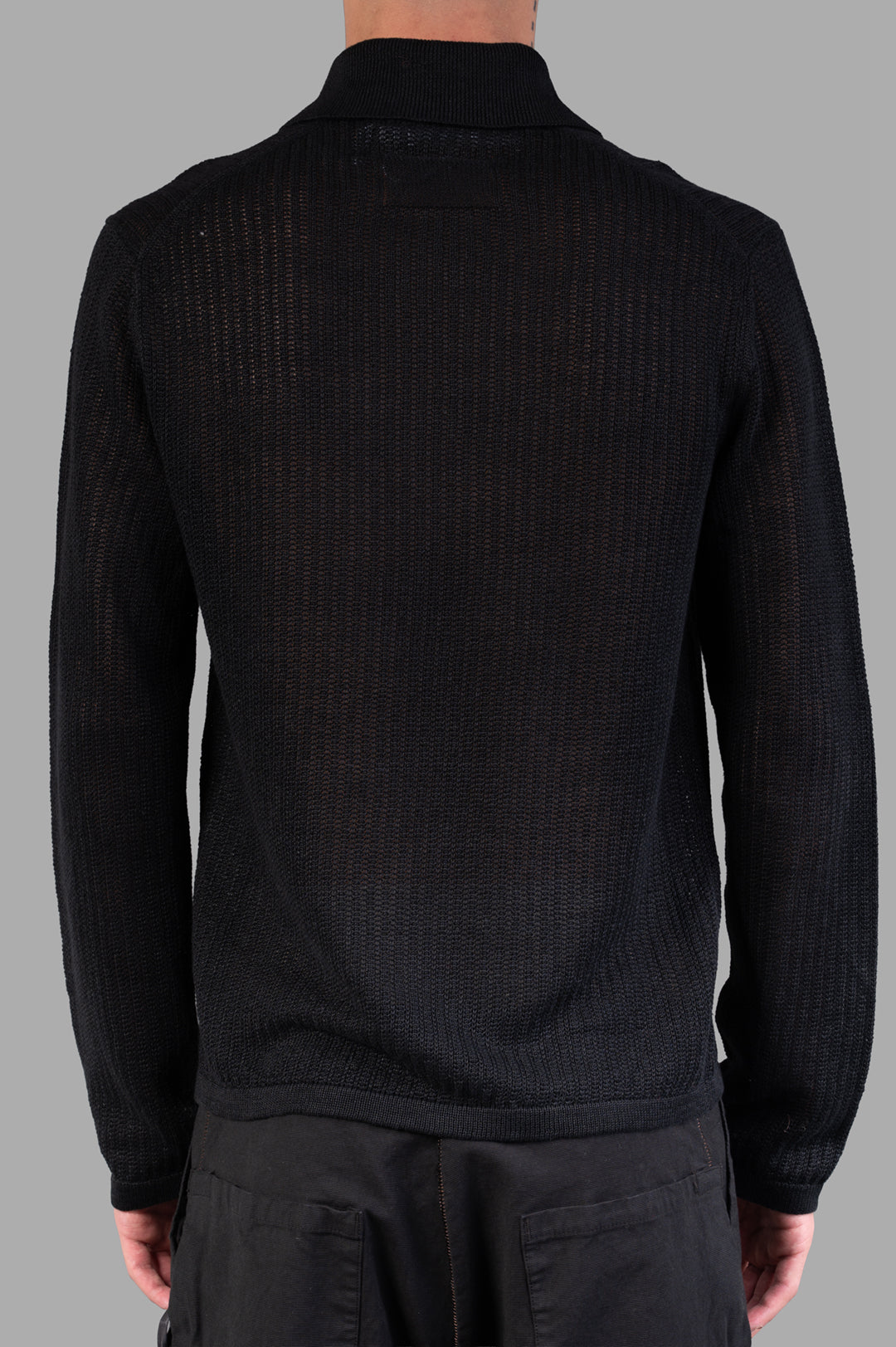 Helmut Lang Long-sleeve Zip Polo in Black, showcasing the back view, featuring textured linen knit and relaxed fit.