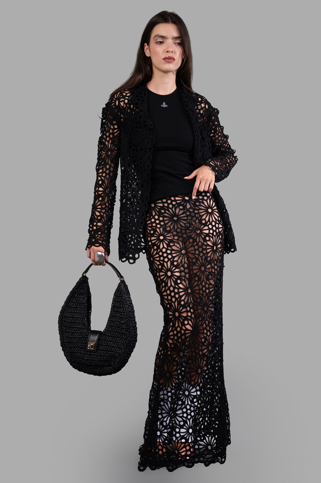 Norma Kamali black Floral-motif Jacket shown on-model with detailed floral pattern and tailored single-breasted fit.
