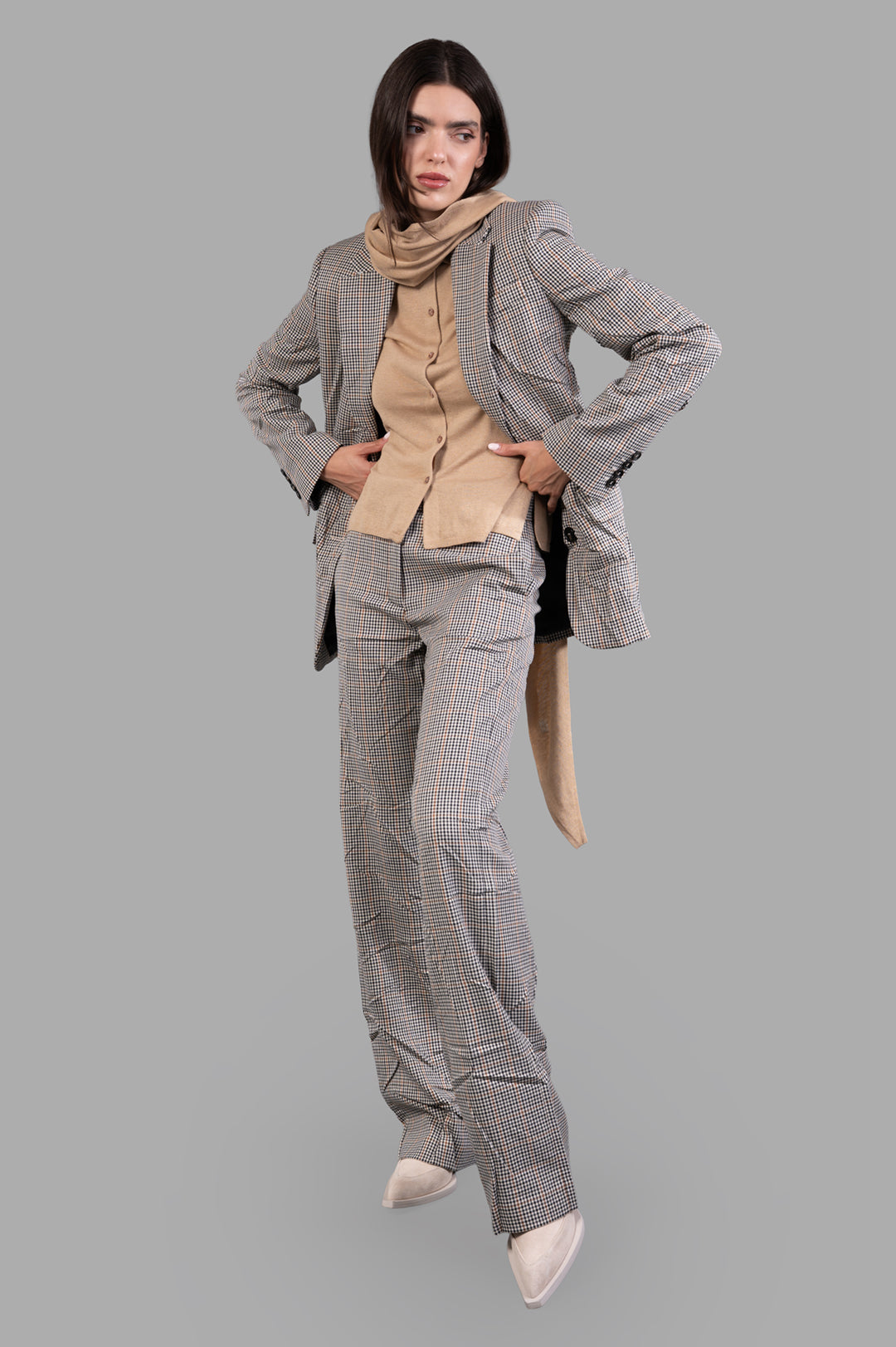MSGM Asymmetric Creased Jacket, front view on-model, showcasing checkered pattern and unique design.