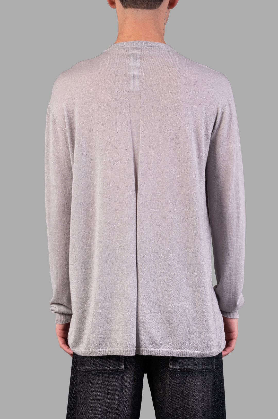 Rick Owens Crew Neck Wool Jumper in grey, showcasing the back detail and ribbed cuffs for a refined texture.