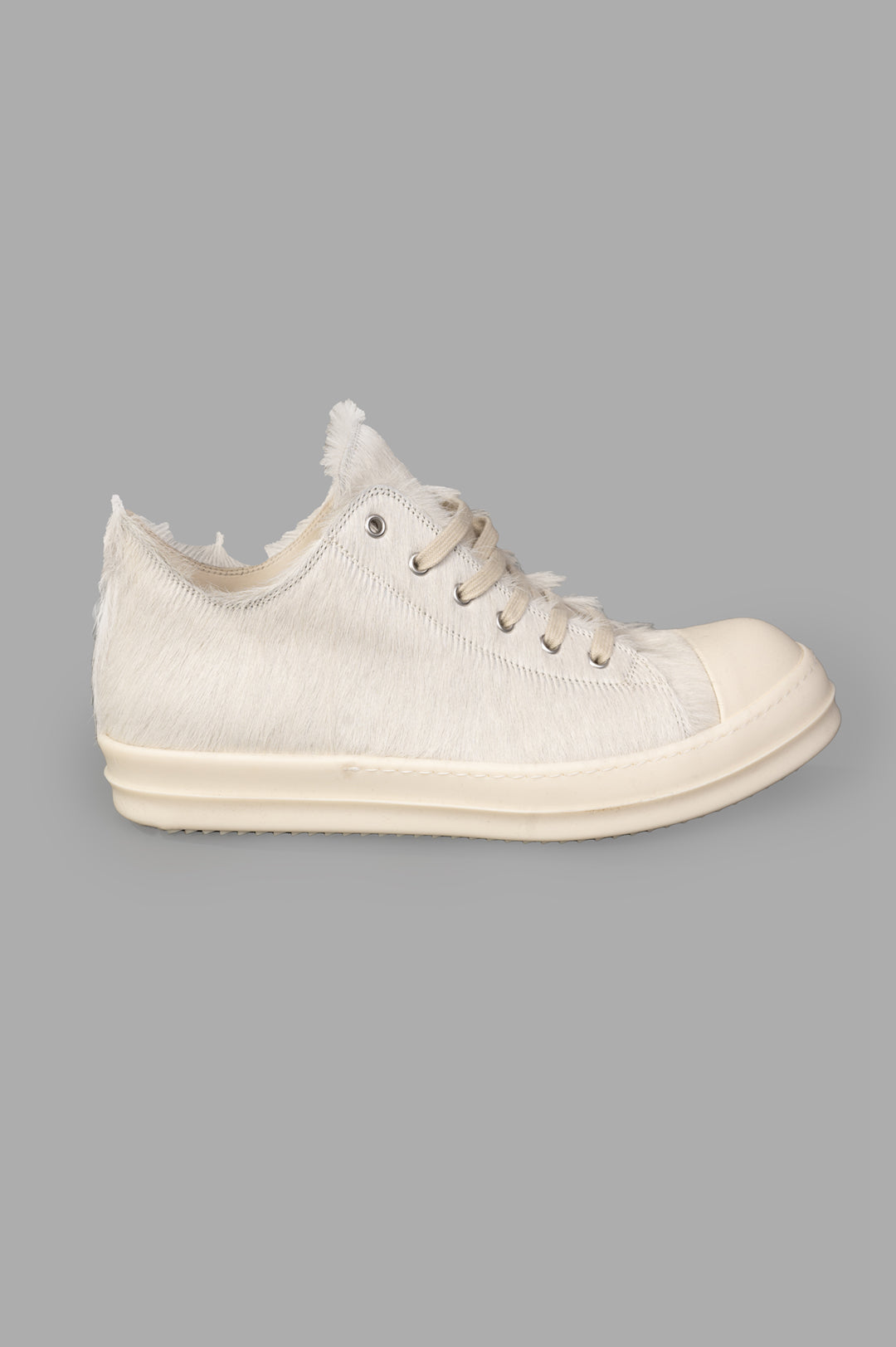 Rick Owens Leather Low Top Sneakers in Milk, side view. Features distinctive textured suede, cowhide, and laces.