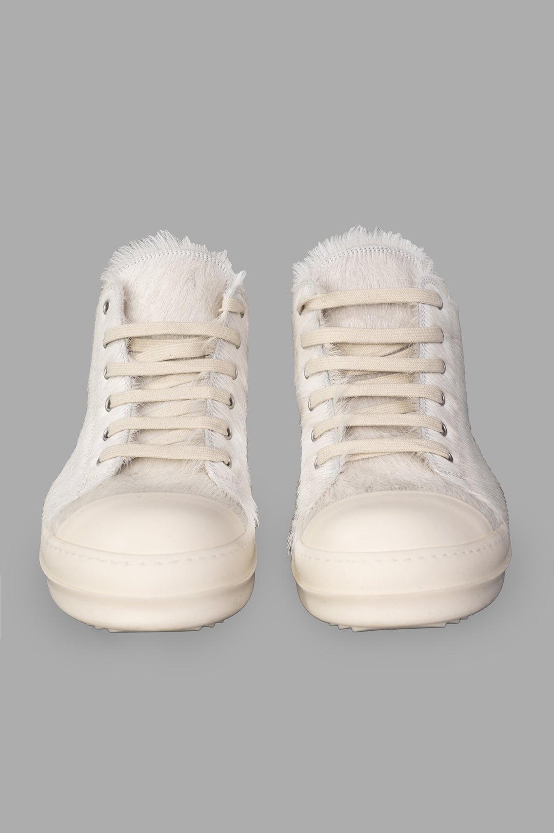 Rick Owens Leather Low Top Sneakers feature a close-up view showcasing unique velour suede and hair-on leather with laces.