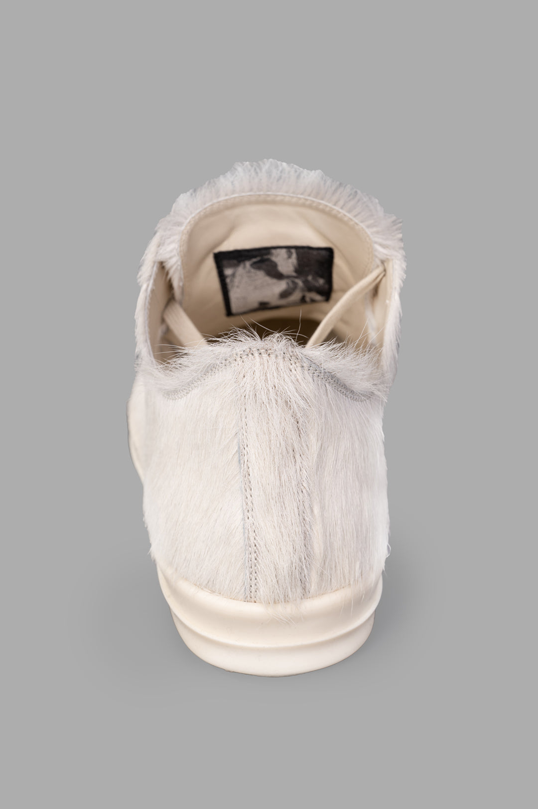 Rick Owens Leather Low Top Sneakers, detailed view of the back showcasing soft hair-on leather and robust bumper sole.