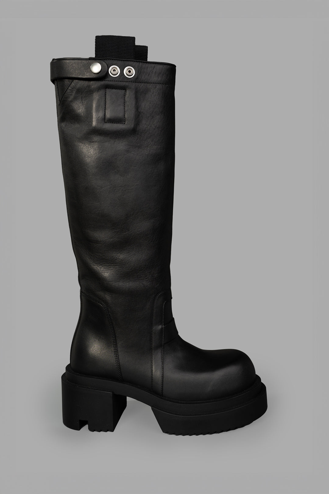 Rick Owens Bogun Knee-high Boots, side view showcasing black leather texture and chunky sole design.