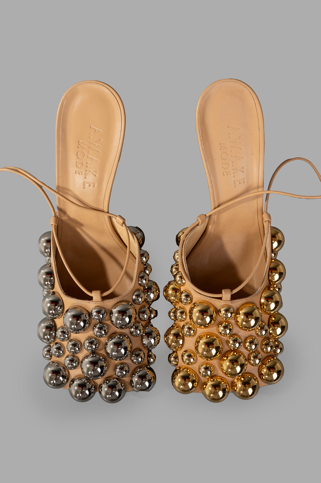 A.W.A.K.E. MODE Evening Embellished Shoes featuring silver and gold spherical adornments and threaded ankle ties.