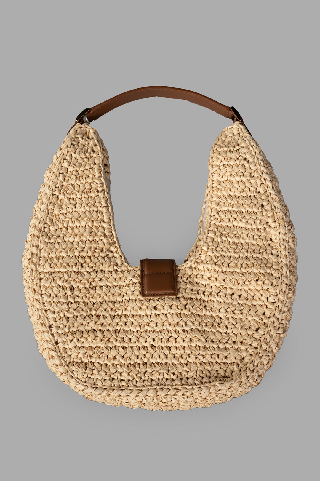 Anine Bing Raffia Monogram Shoulder Bag in Tan, showcasing a top view with raffia texture and leather trim for elegance.
