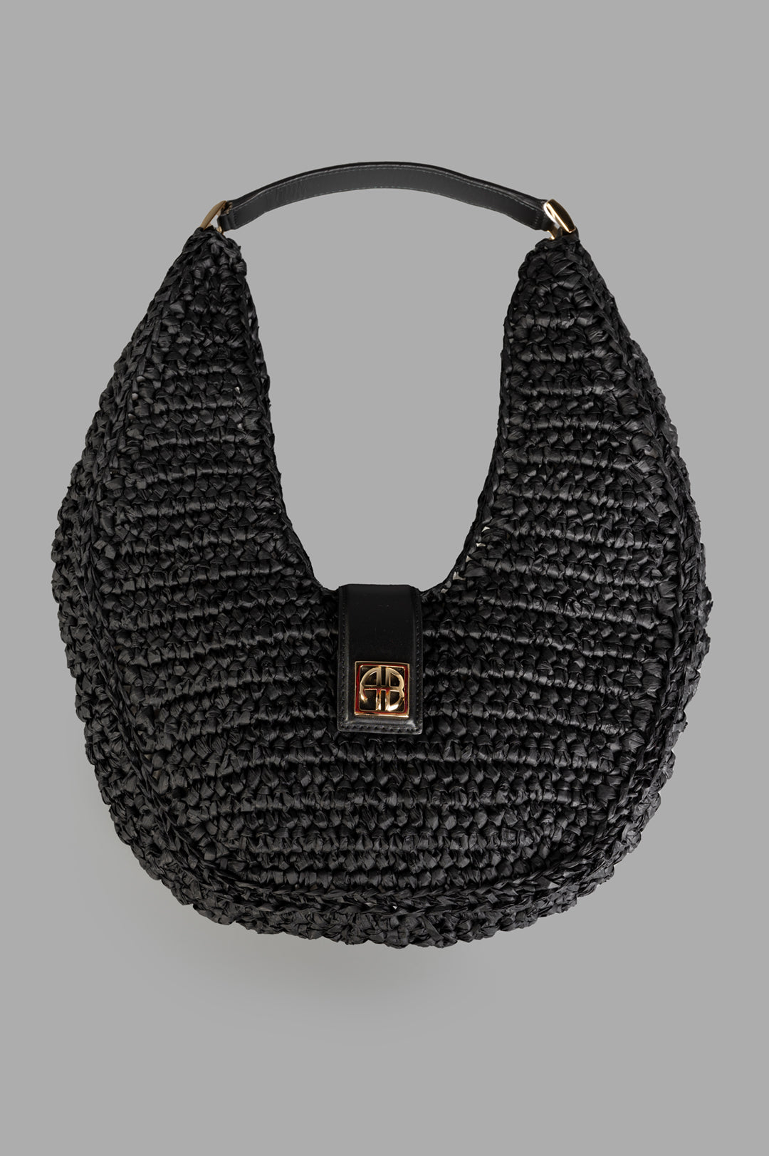 Anine Bing Raffia Monogram Shoulder Bag in Black, featuring front view of raffia texture with leather trim and gold logo.