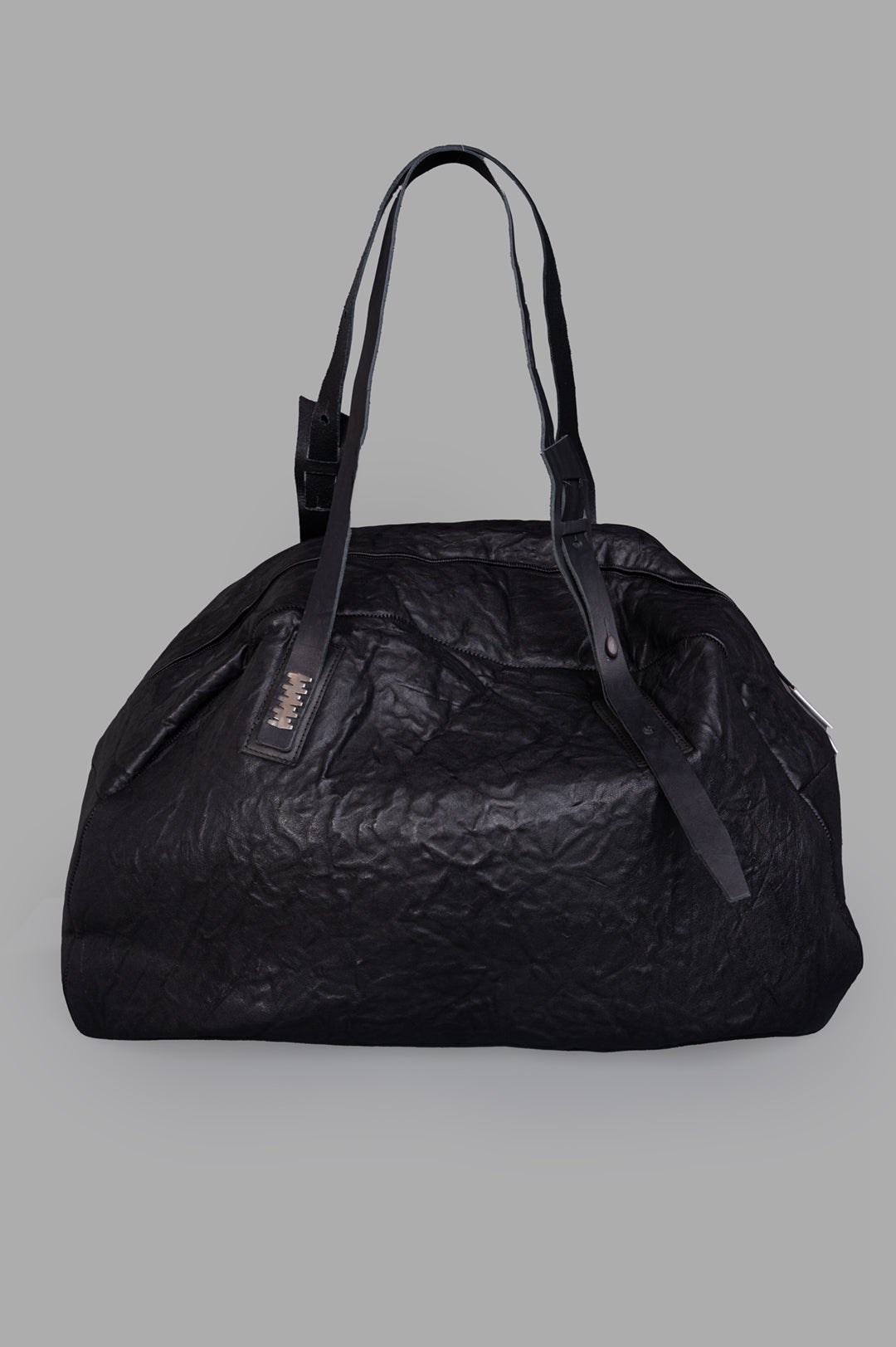 Isaac Sellam oversized leather bag, front view, crinkled texture, double handles, black, ideal for travel or gym essentials.
