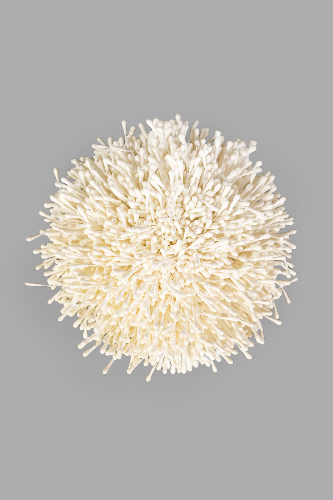 By Malene Birger white Henna Brooch, top view. Anemone-inspired design in 100% polyester, detailed texture.