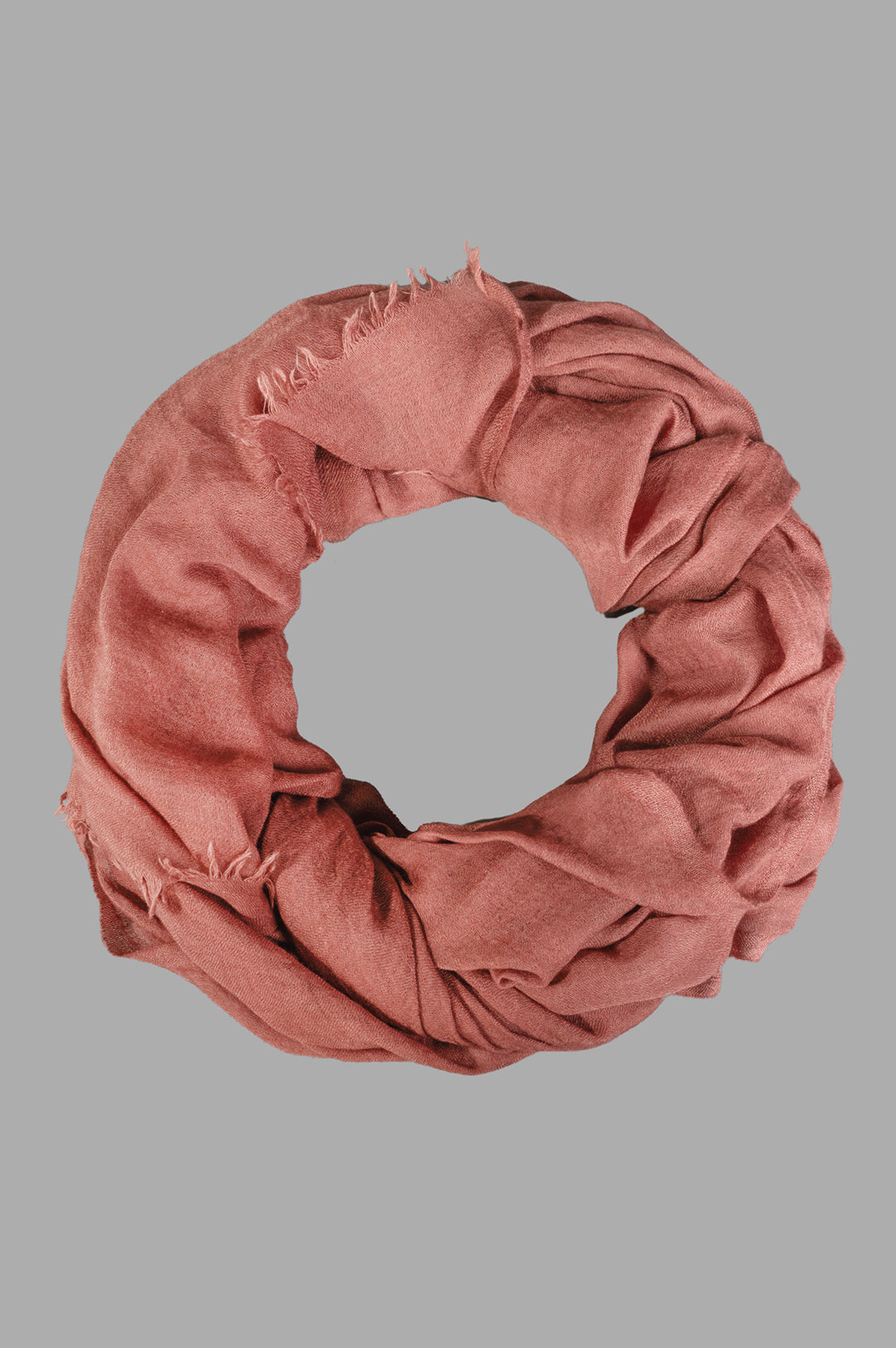 Rick Owens Concordians Follo scarf in rosewood, close-up of soft cashmere-silk texture displayed in a circular arrangement.