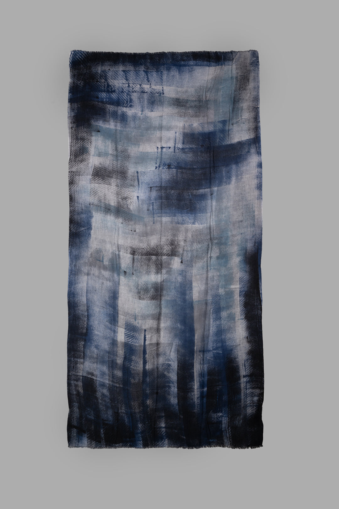 Avant Toi. Graphic-print Scarf in Blue featuring a bold design and frayed edges, displayed flat to highlight texture.