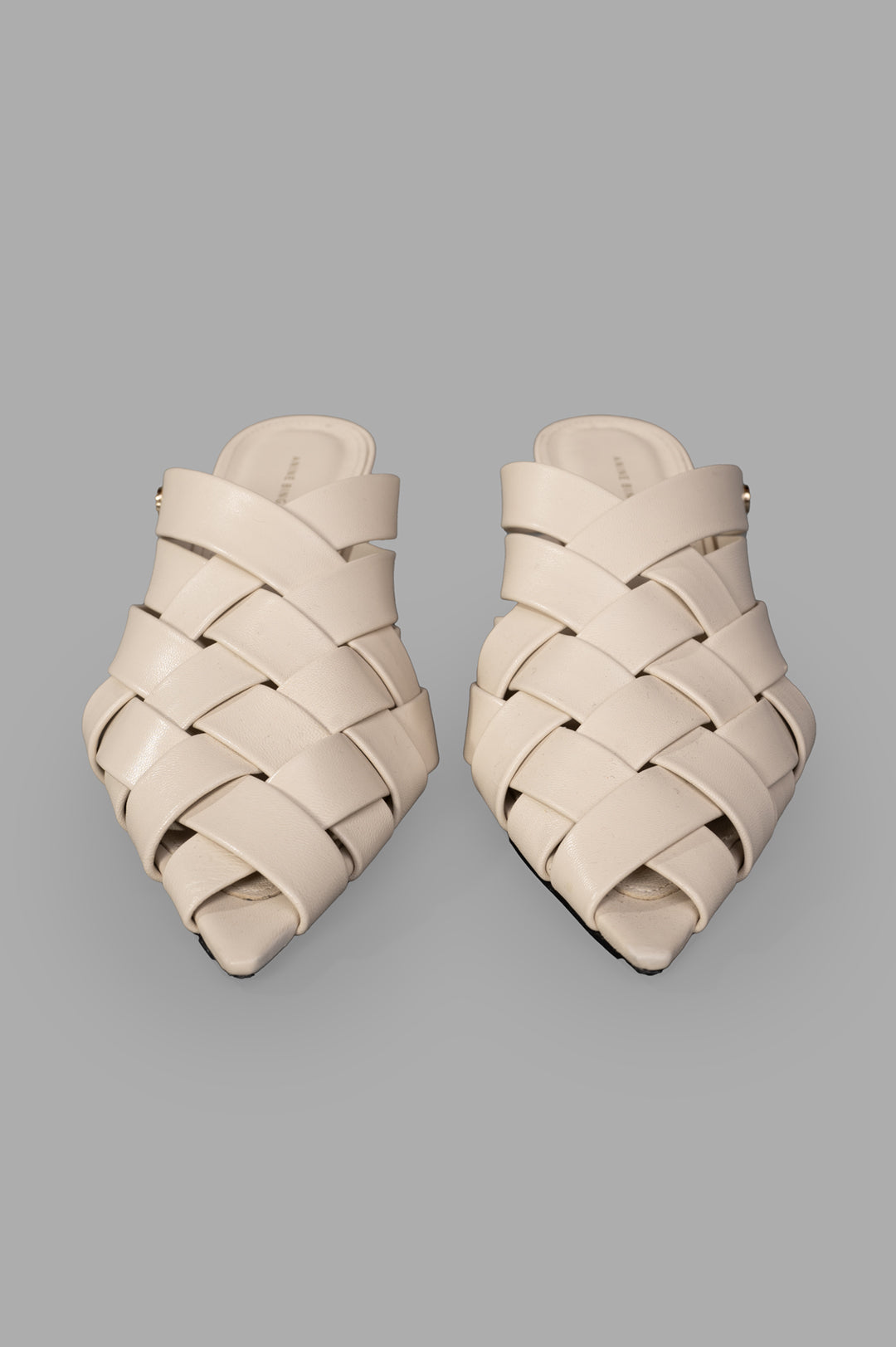 Anine Bing. Eve Mules featuring woven design and smooth 100% leather in bone color, showing the top view detail.