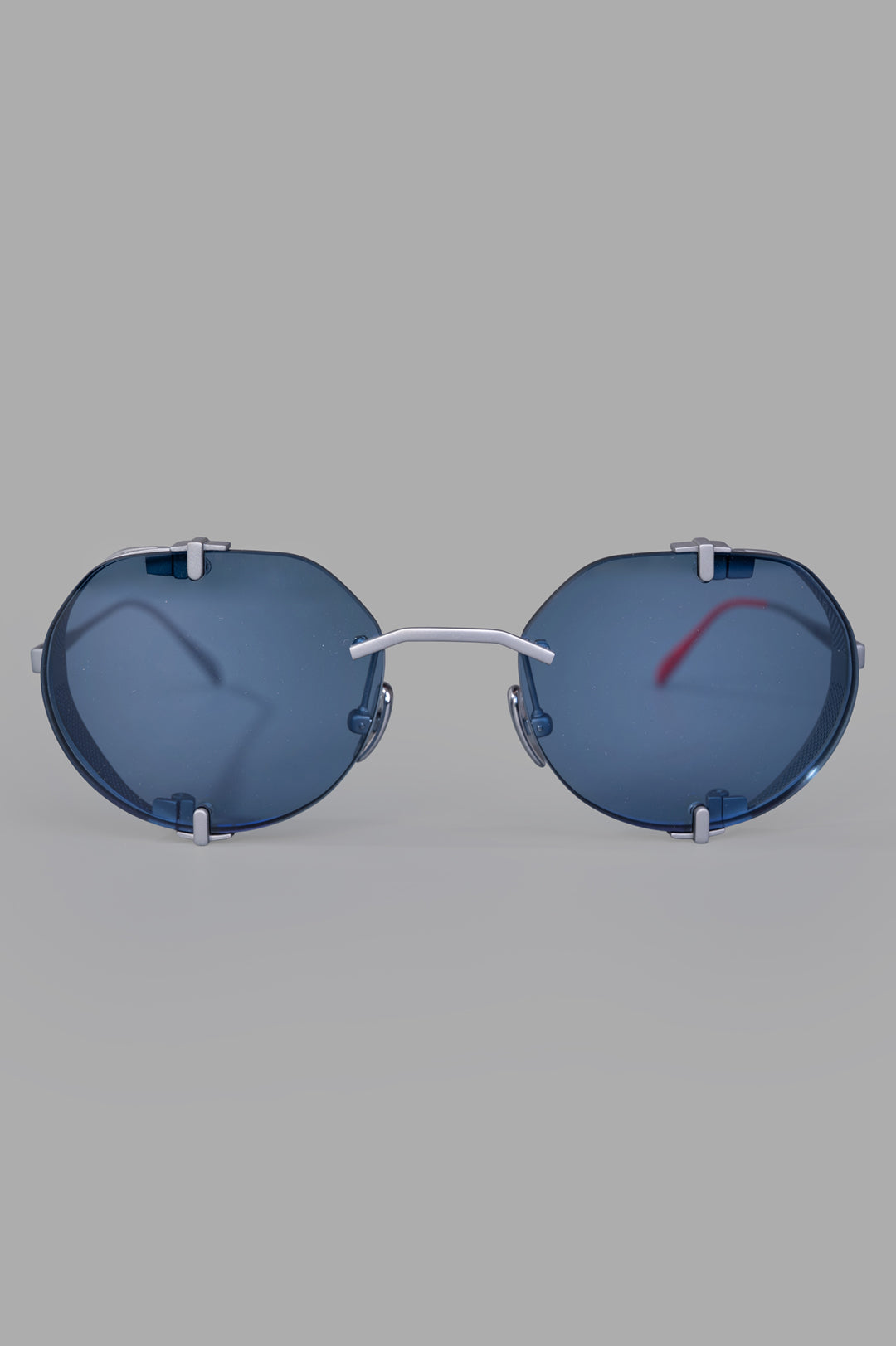 Vysen Eyewear The Uttar - UT4 rimless round titanium glasses with clear blue lenses, front view.