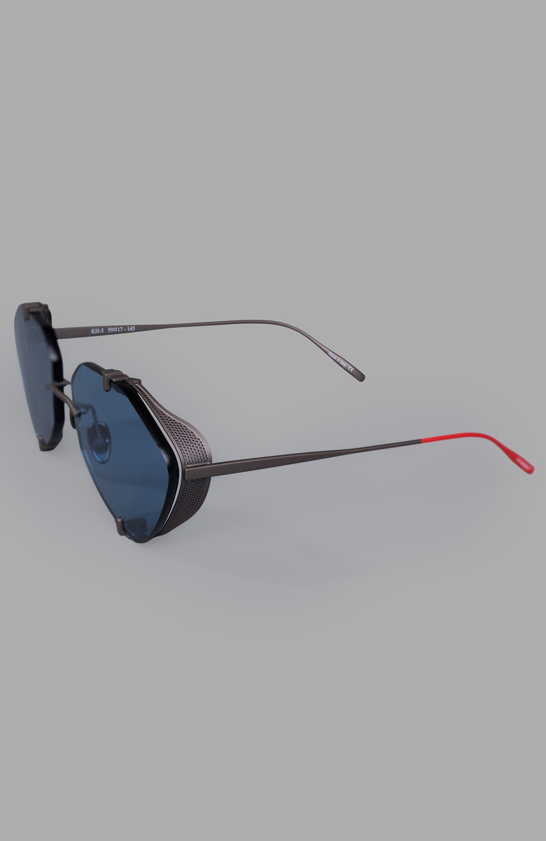 Vysen Eyewear The Khoid - KH5 rimless titanium aviator sunglasses showcasing a sleek side view with blue lenses and red.