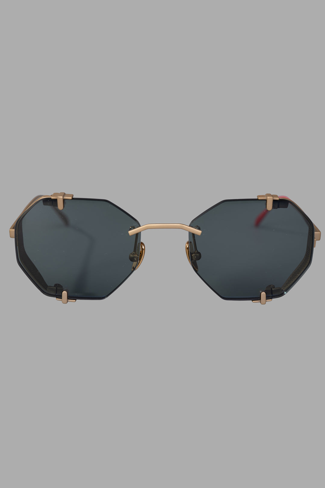 Vysen Eyewear The Sever - SV2 front view, rimless octagonal gold matte titanium frame with green lenses.