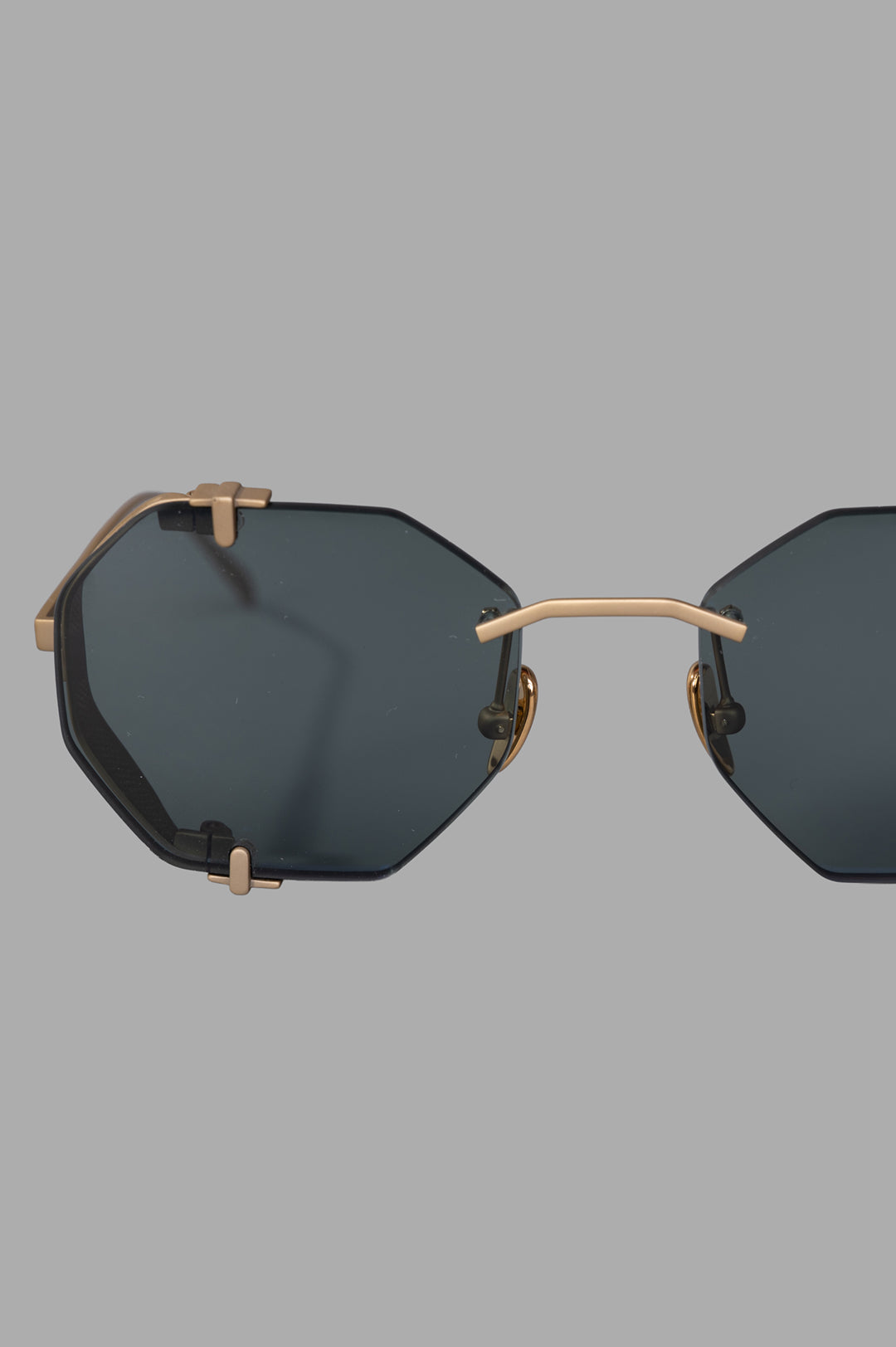 Vysen Eyewear The Sever - SV2 features a gold matte titanium rimless octagonal frame with dark green lenses and intricate.