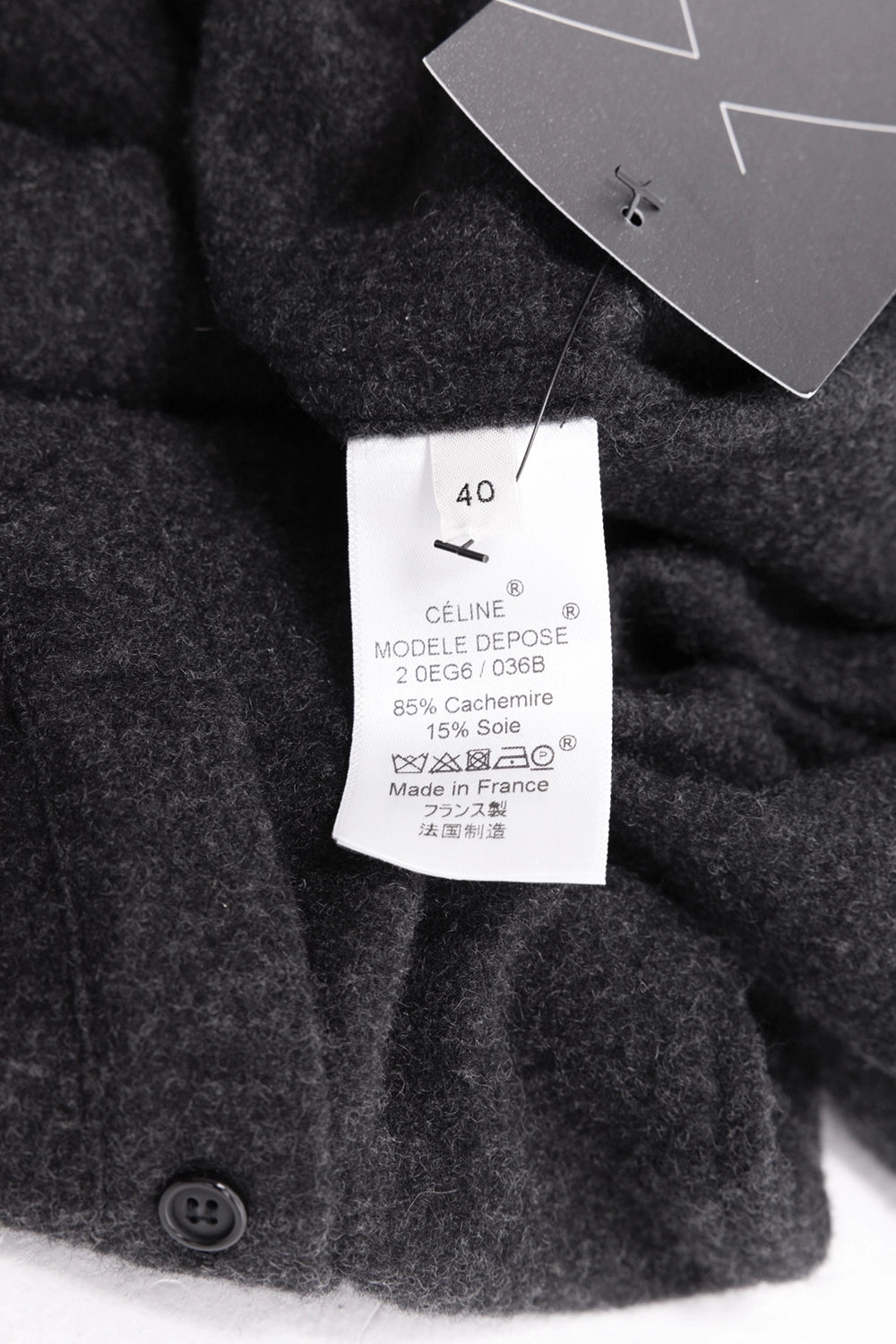 Pre-owned Celine women's long shirt in charcoal grey, care-tag view, size 40 label with cashmere-silk composition