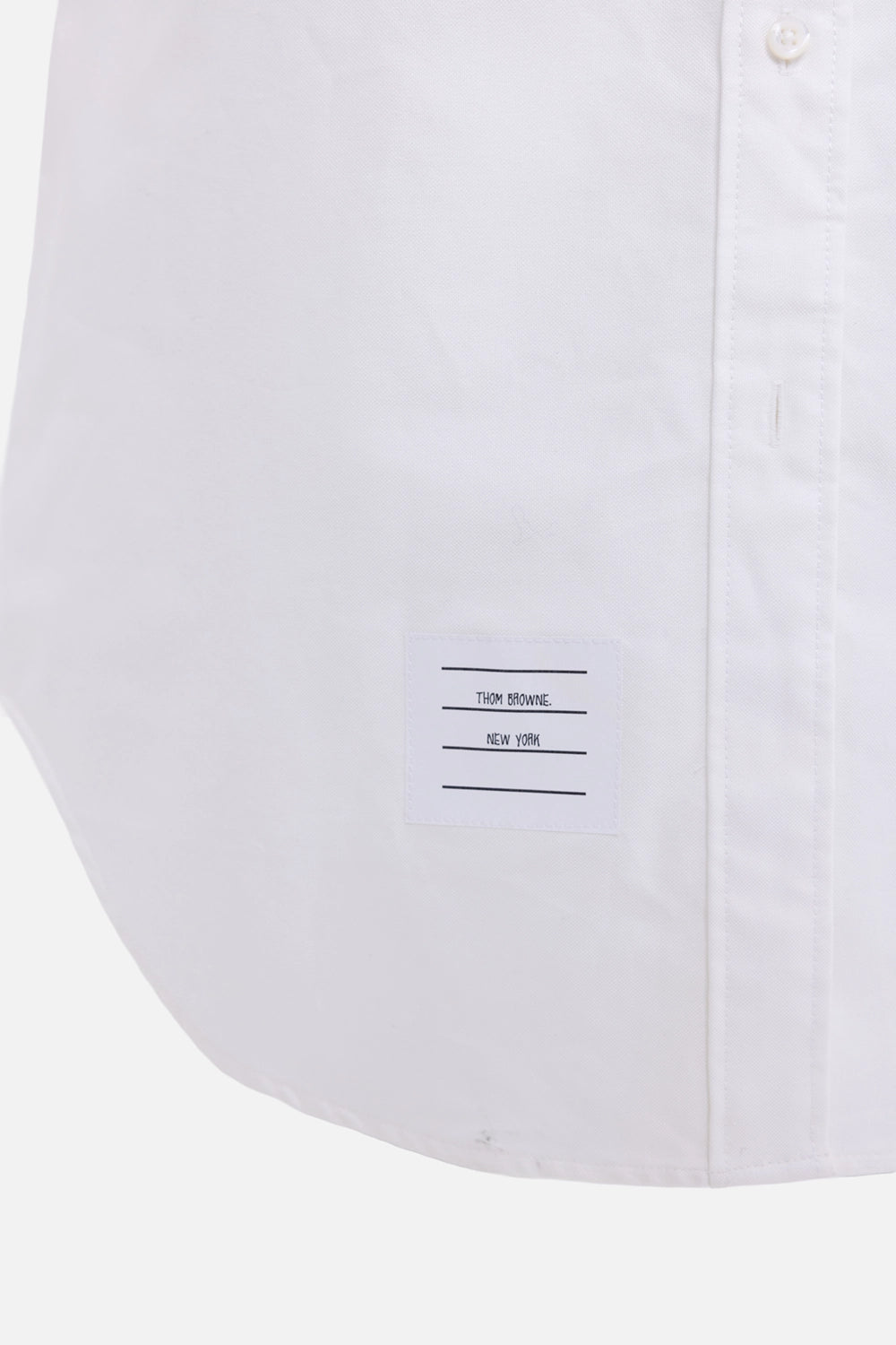 Pre-owned Thom Browne women's shirt dress in white, hem detail, Thom Browne New York name-label patch
