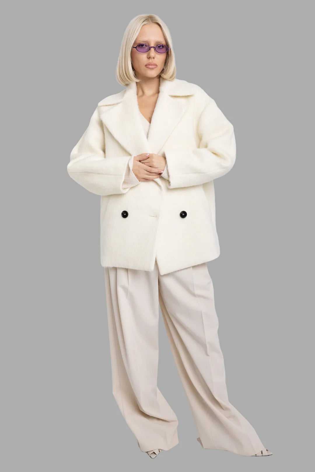 MSGM women's off-white wool-blend short coat, on-model full length, oversized double-breasted cut with wide lapels.