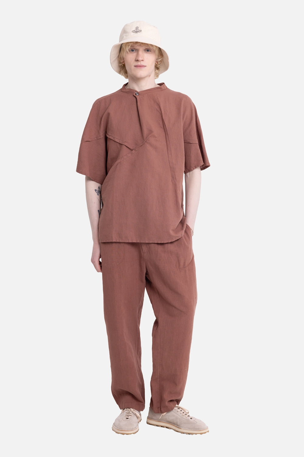 Vuscichè men's short-sleeve shirt in rust brown, on-model full-length, asymmetric chest panel