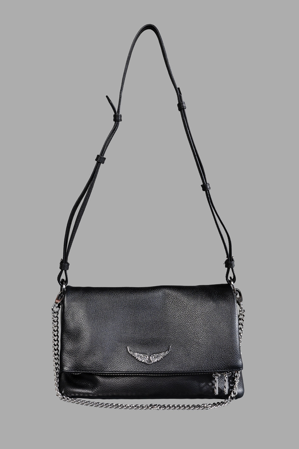 Zadig & Voltaire shoulder bag in black, front view, grained leather, crystal wings logo, chain detail, adjustable leather strap