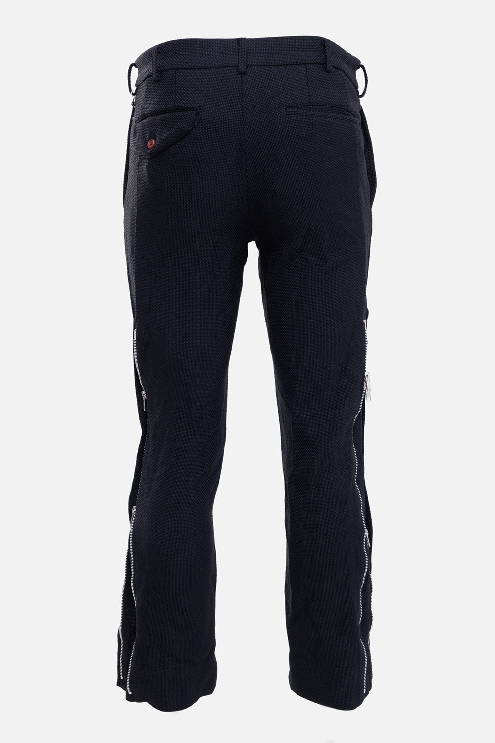 Comme des Garçons men's trousers in black, back view, welt pockets and silver side zippers