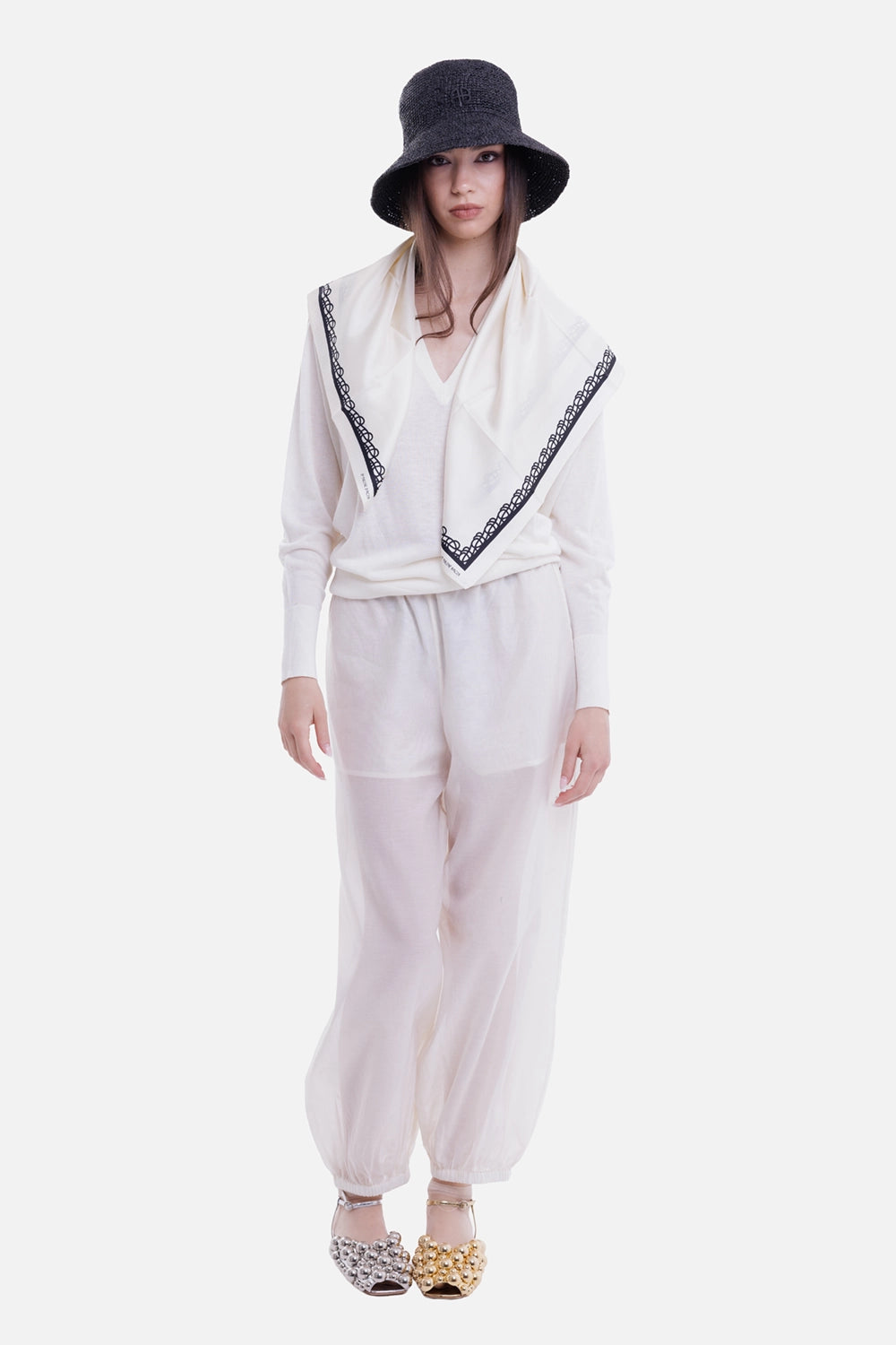 By Malene Birger women's trousers in Soft White, on-model view with sheer balloon legs and elastic cuffs
