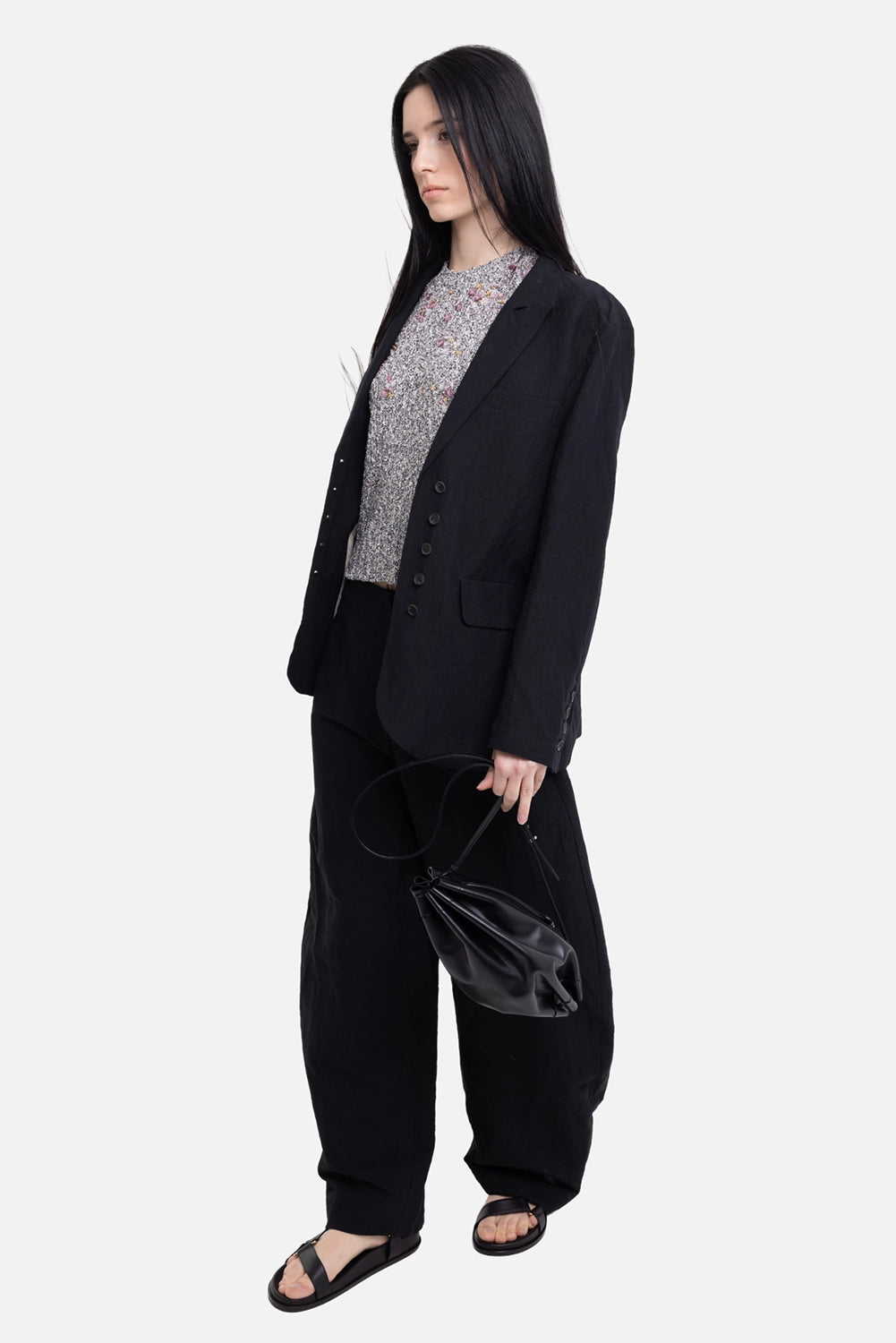 Gentry Portofino women's linen-cotton blazer in black, on-model full-length view, relaxed fit and flap pockets
