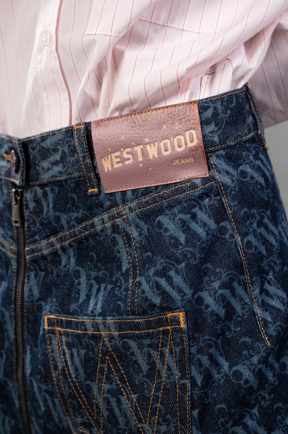 Vivienne Westwood skirt in laser denim, logo detail, pink WESTWOOD JEANS leather patch at waistband