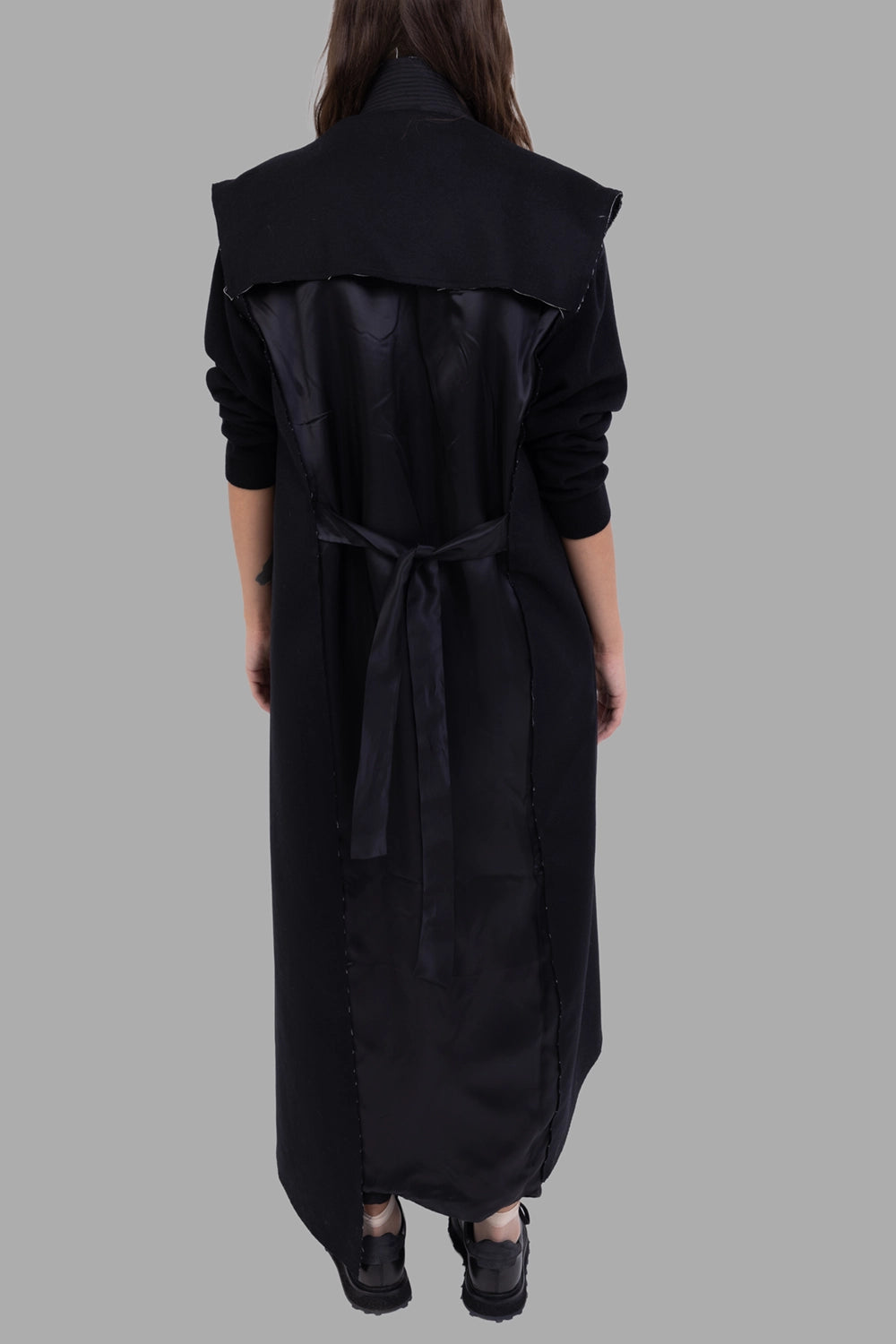 Giovanni Cavagna women sleeveless coat in black, back view, open satin panel with waist tie

