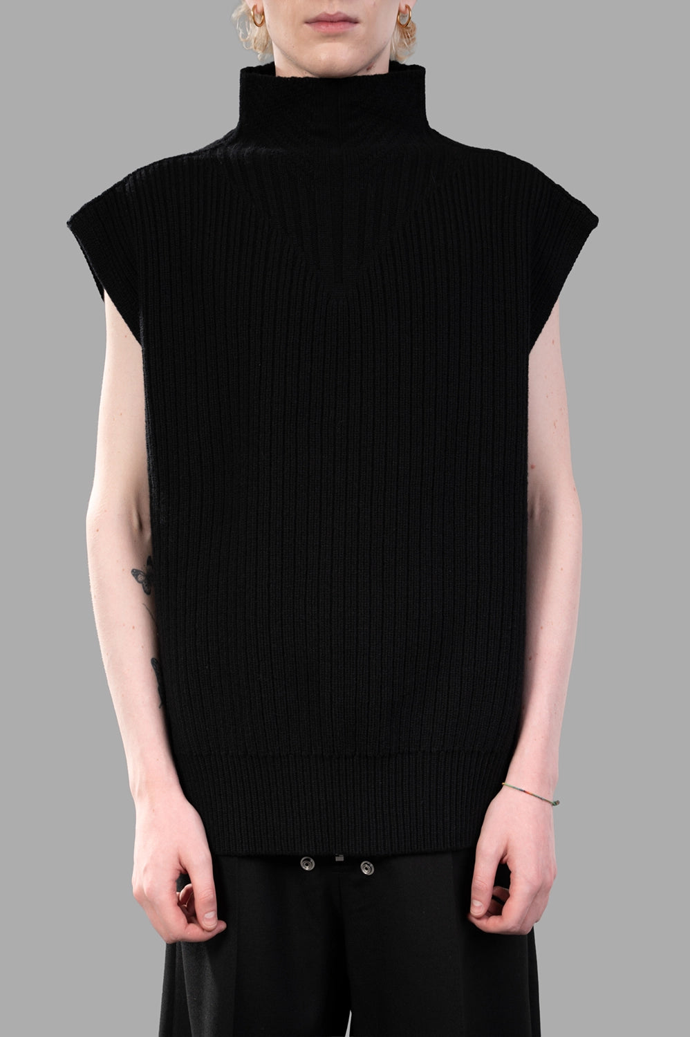 Rick Owens sleeveless turtleneck sweater in black, front view with V-rib panel and tall turtle neck