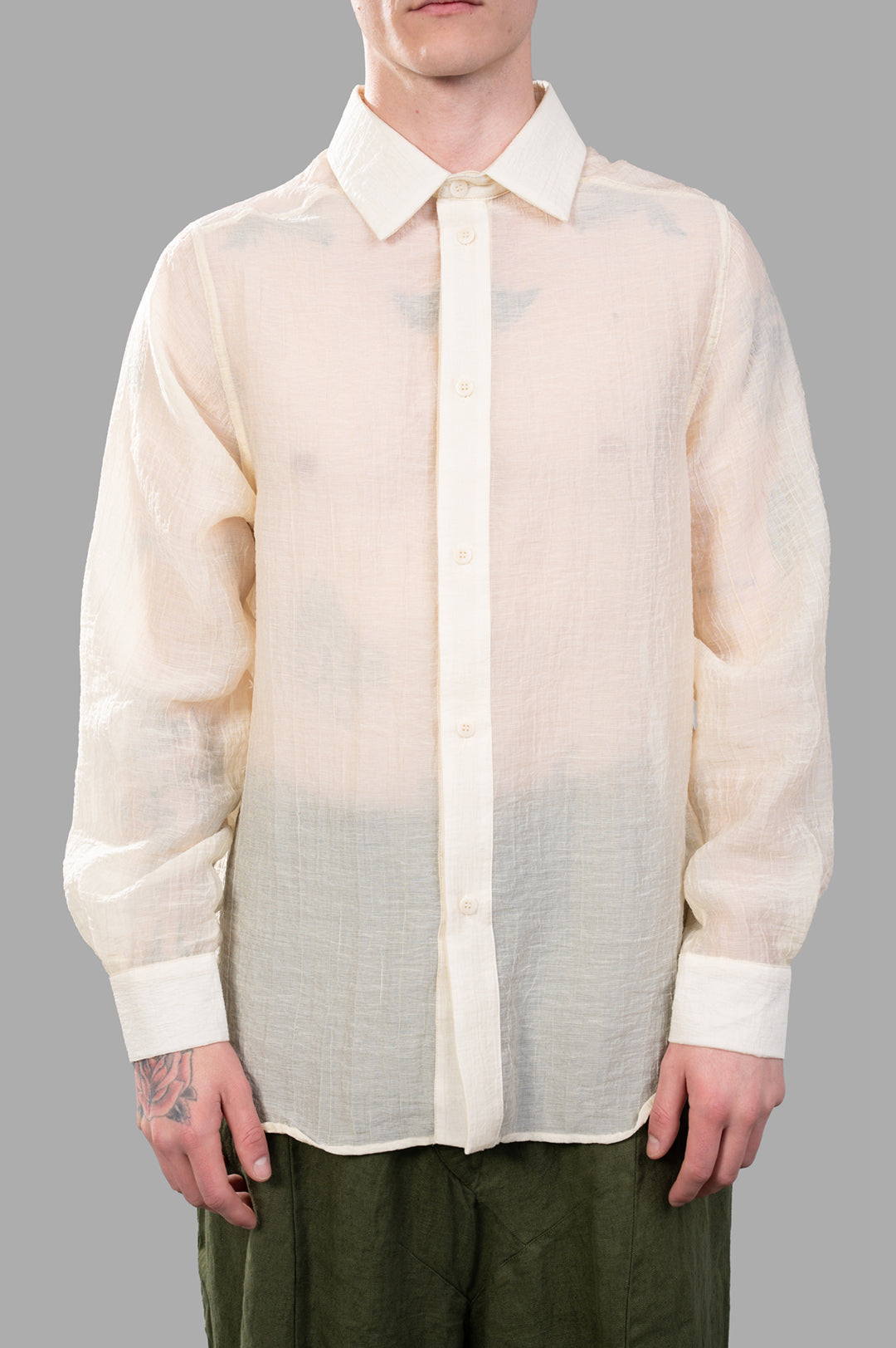 Justin Gall Crinkled Shirt in ecru, featuring semi-transparent texture, relaxed fit, and unique crinkled design on model.