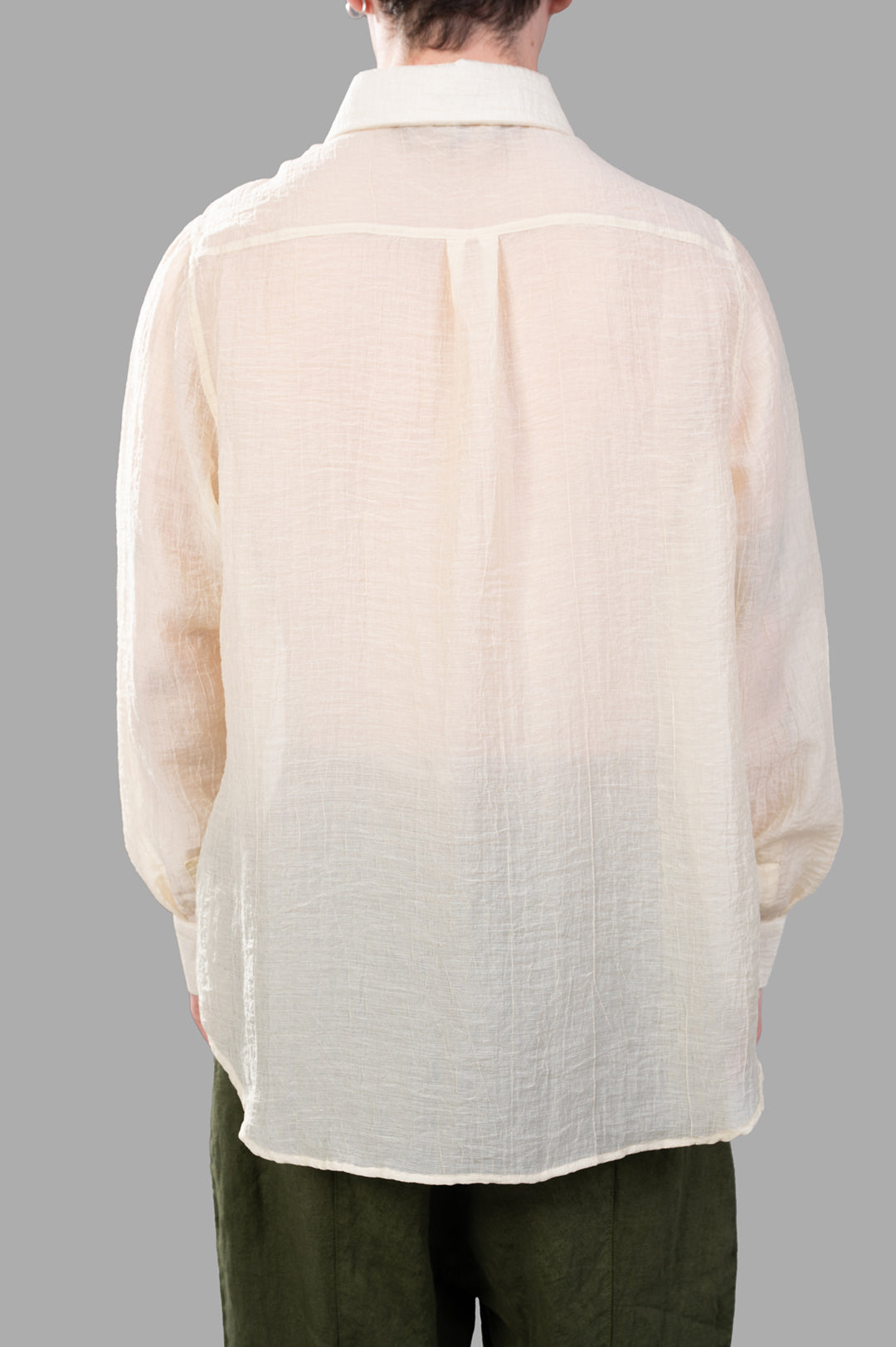 Justin Gall Crinkled Shirt in ecru, displaying relaxed-fit back texture and unique semi-transparent detailing.