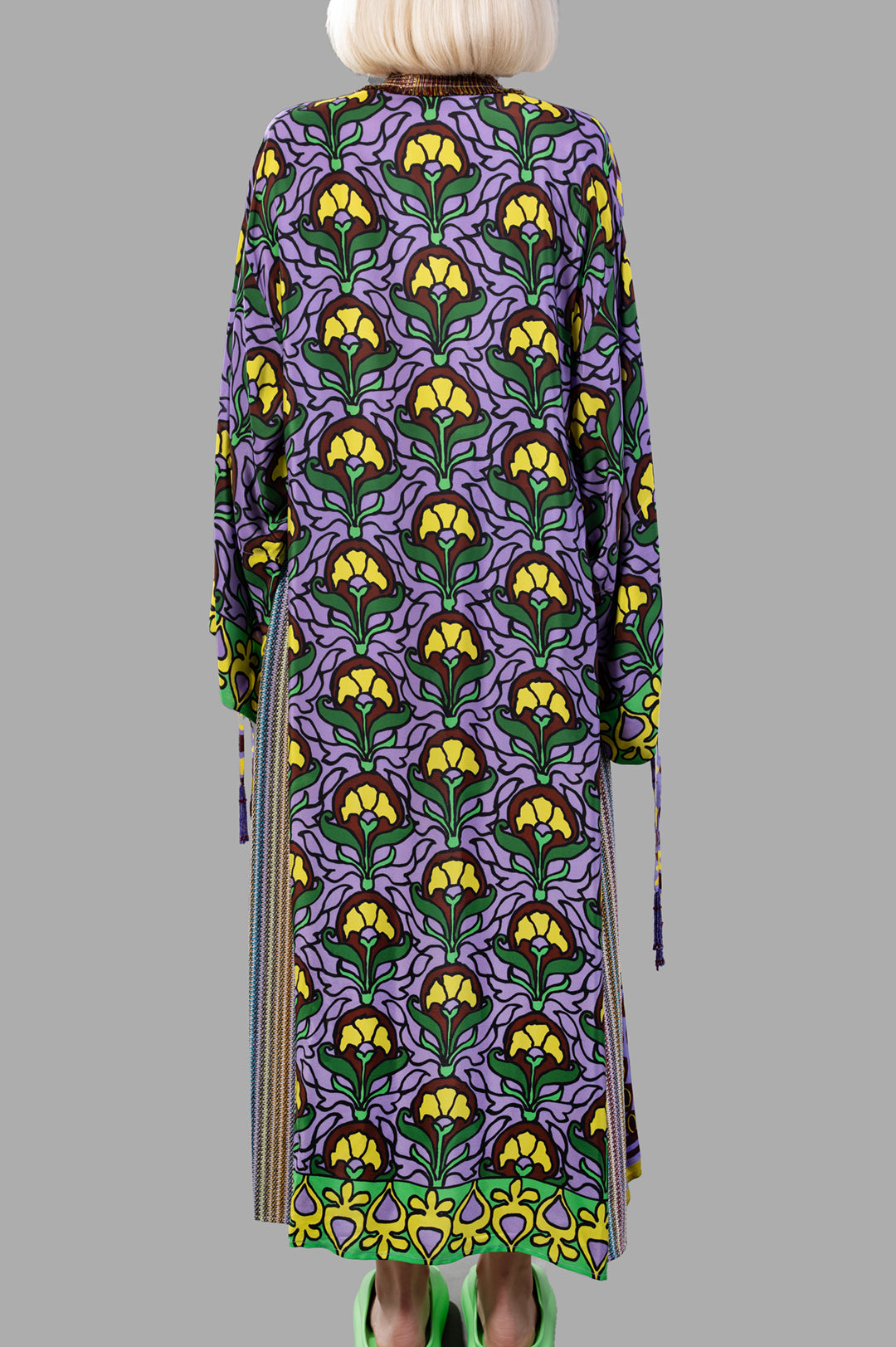Anjuna Embellished Printed Crepe Kaftan features a vibrant floral design, shown from the back with tassel details.