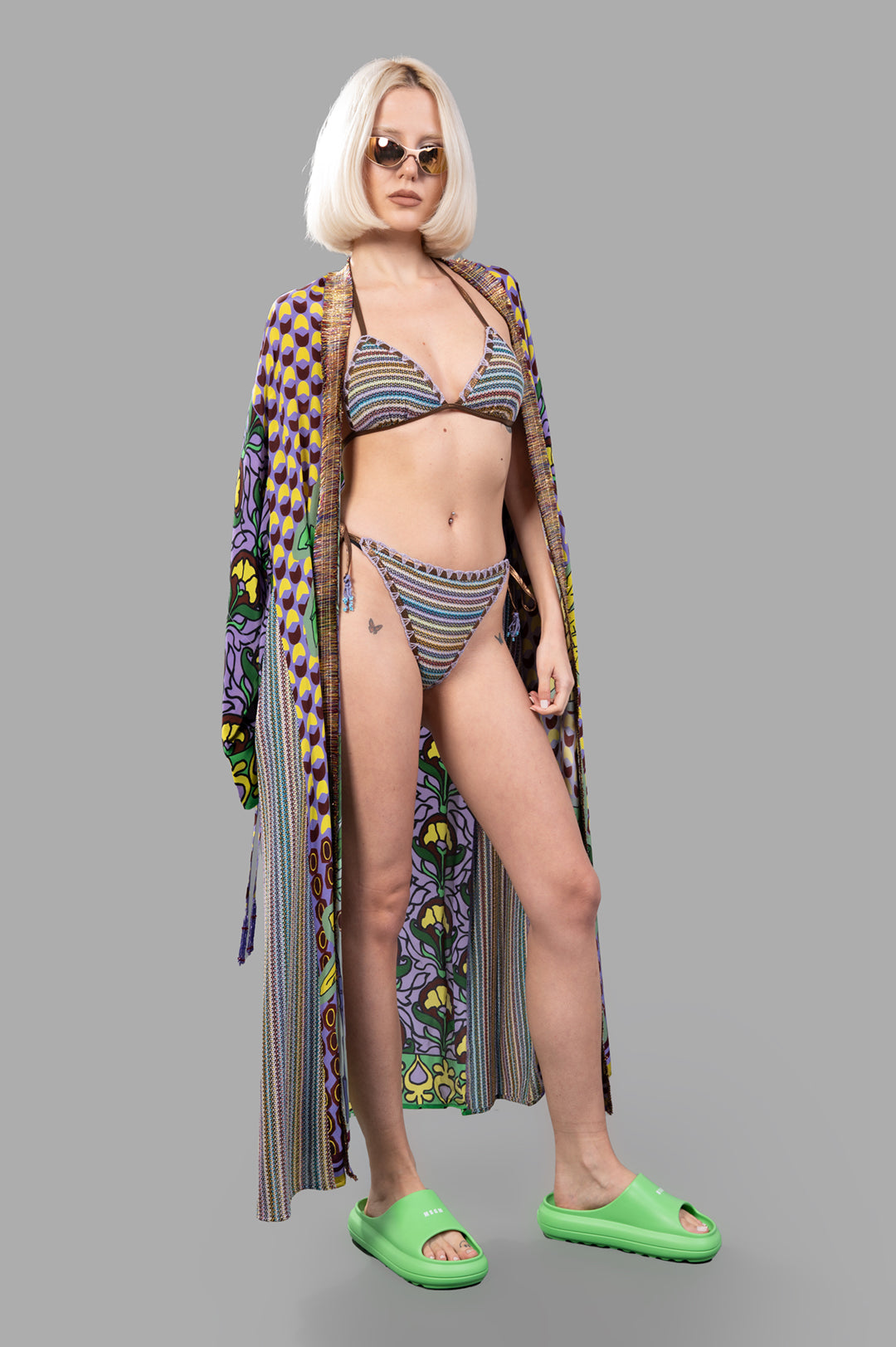 Anjuna Striped Triangle Bikini Set in vibrant multicolor on model with tie-side bottoms and colorful cover-up.