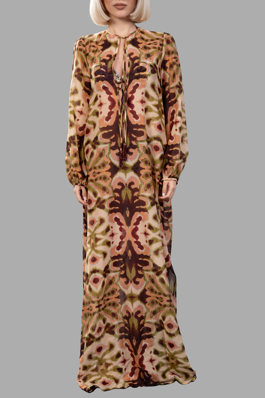 Anjuna Abstract-print Maxi Dress on model, featuring a vibrant multi-color pattern and elegant long sleeves.